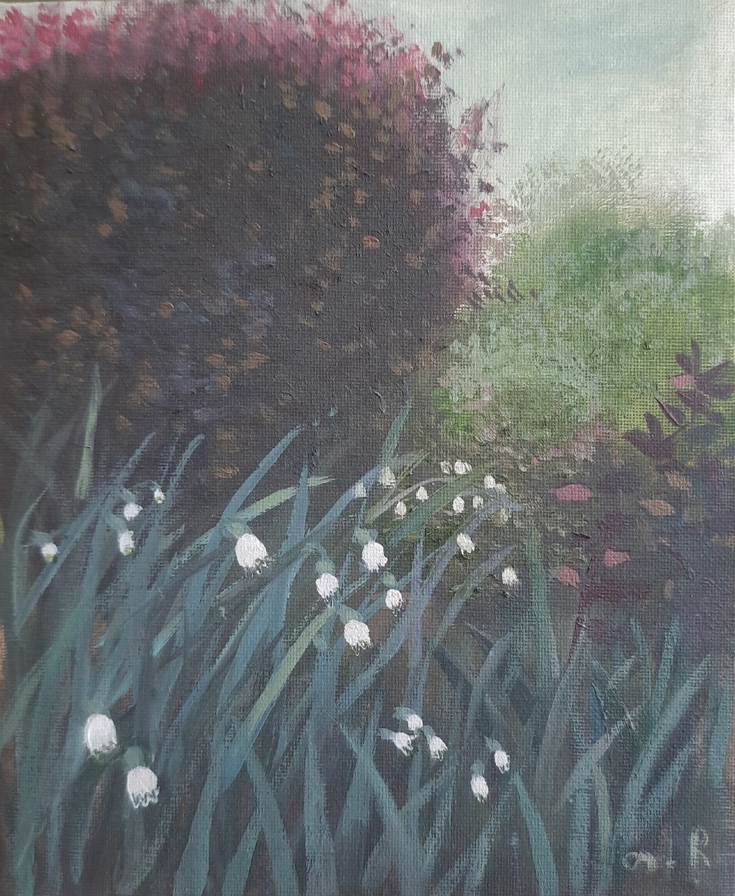 A moody garden scene featuring white flowers and a dark hedge.