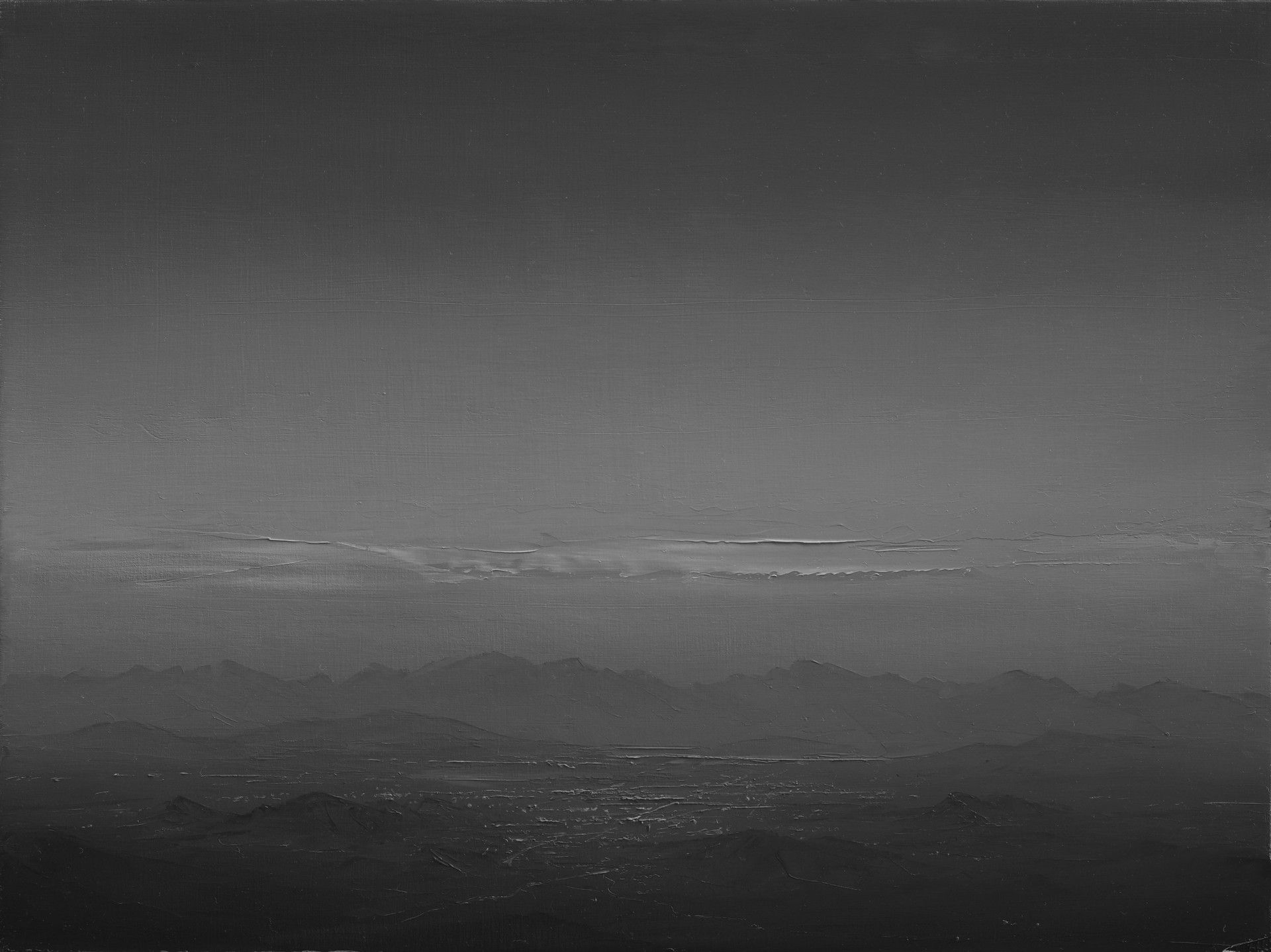 A black and white photo of a mountain range.