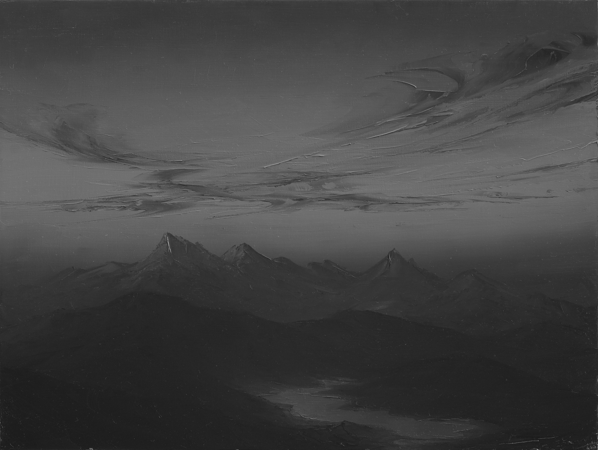 A black and white photo of a mountain range.