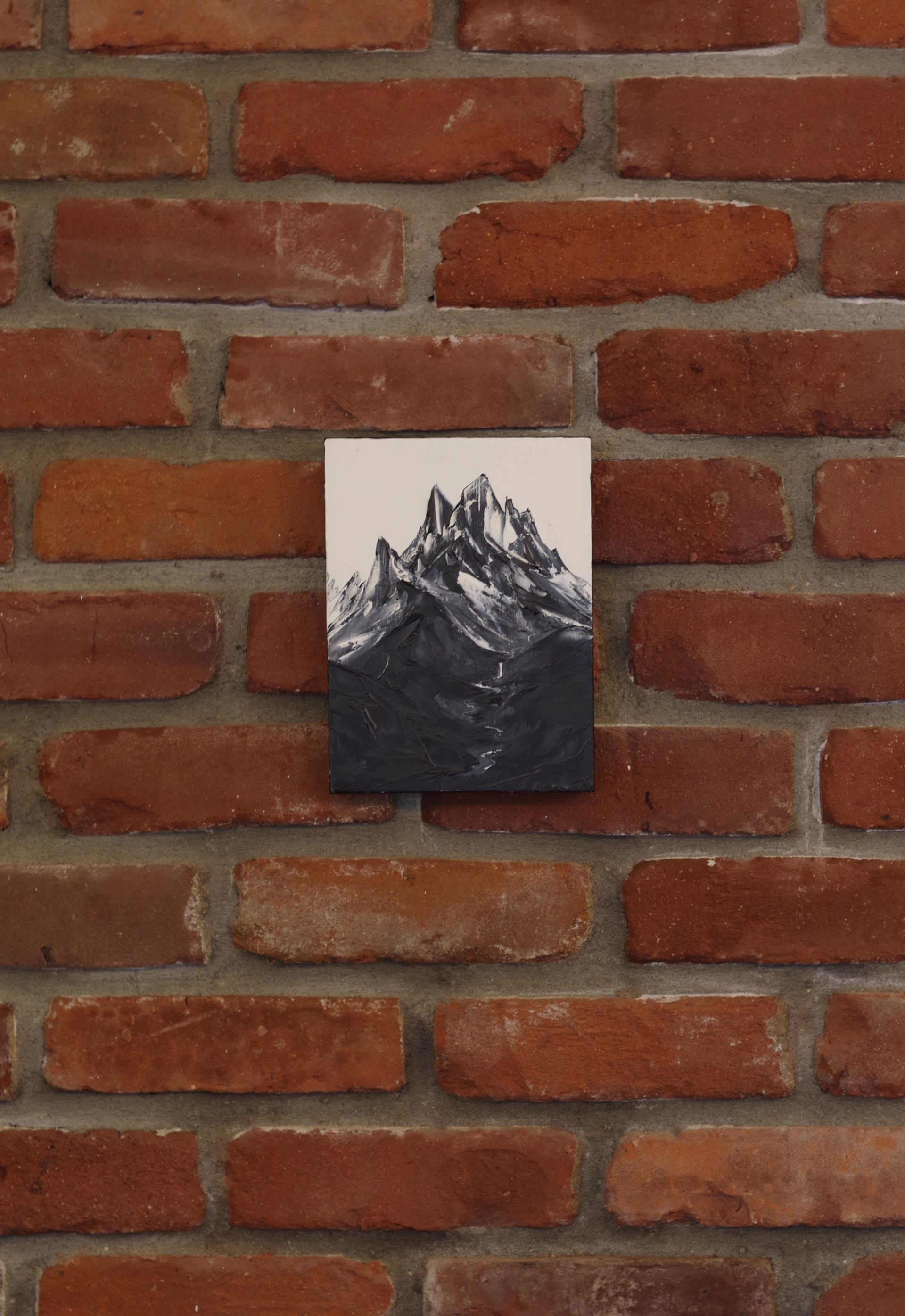 A black and white photo of a mountain.