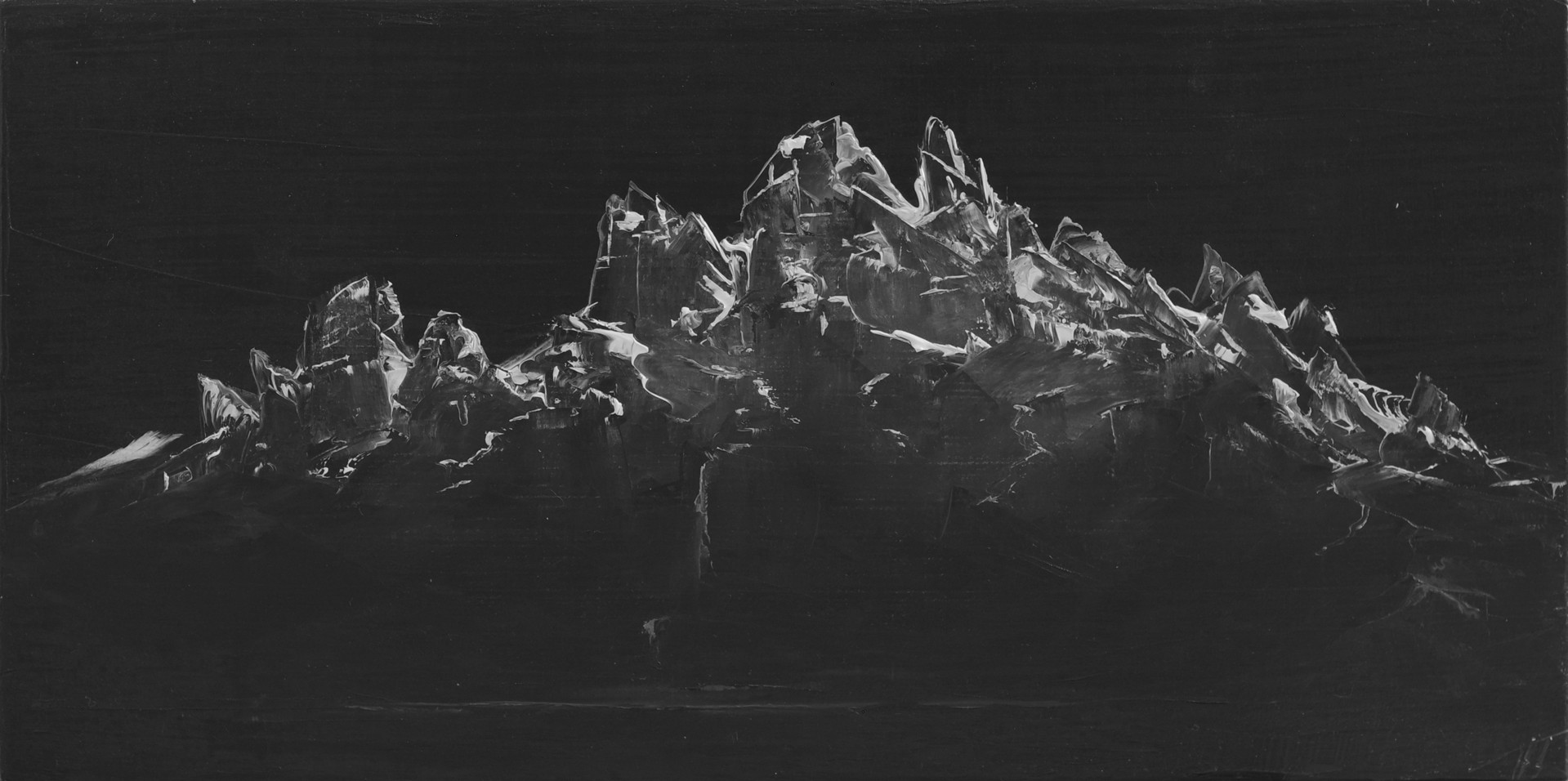 A black and white photo of a mountain.