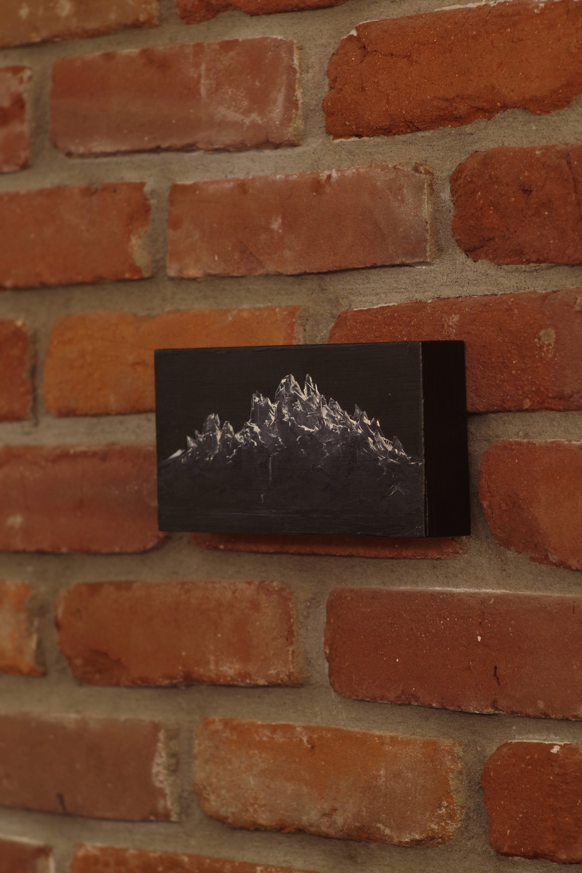 A black and white photo of a mountain.
