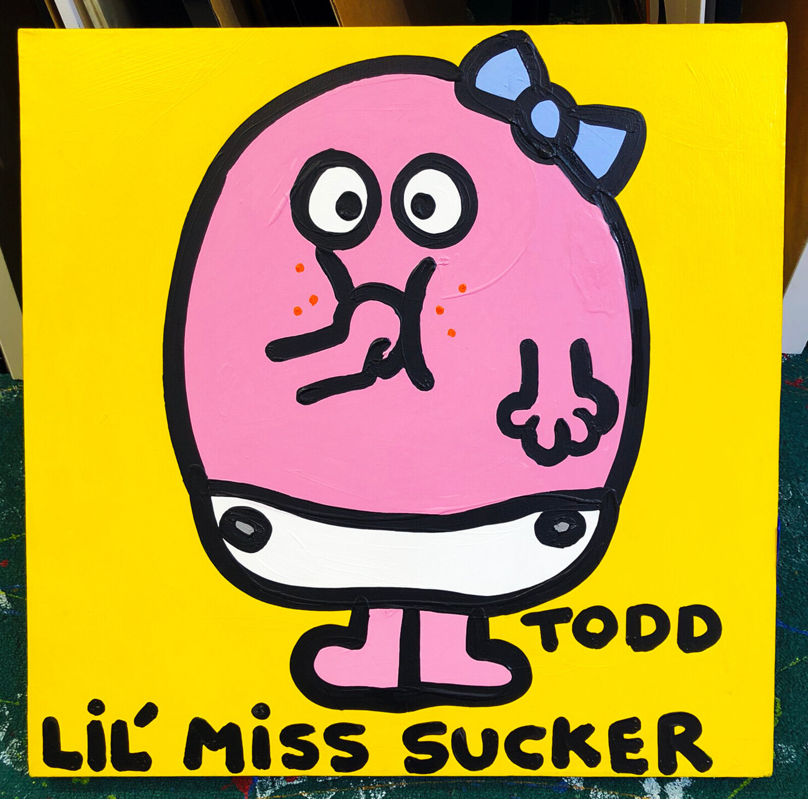 A painting of a pink cartoon character with a bow on its head.