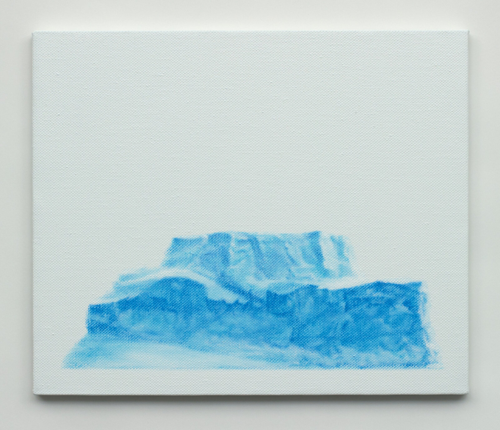 A minimalist painting of a blue, layered mountainous form against a stark white canvas.