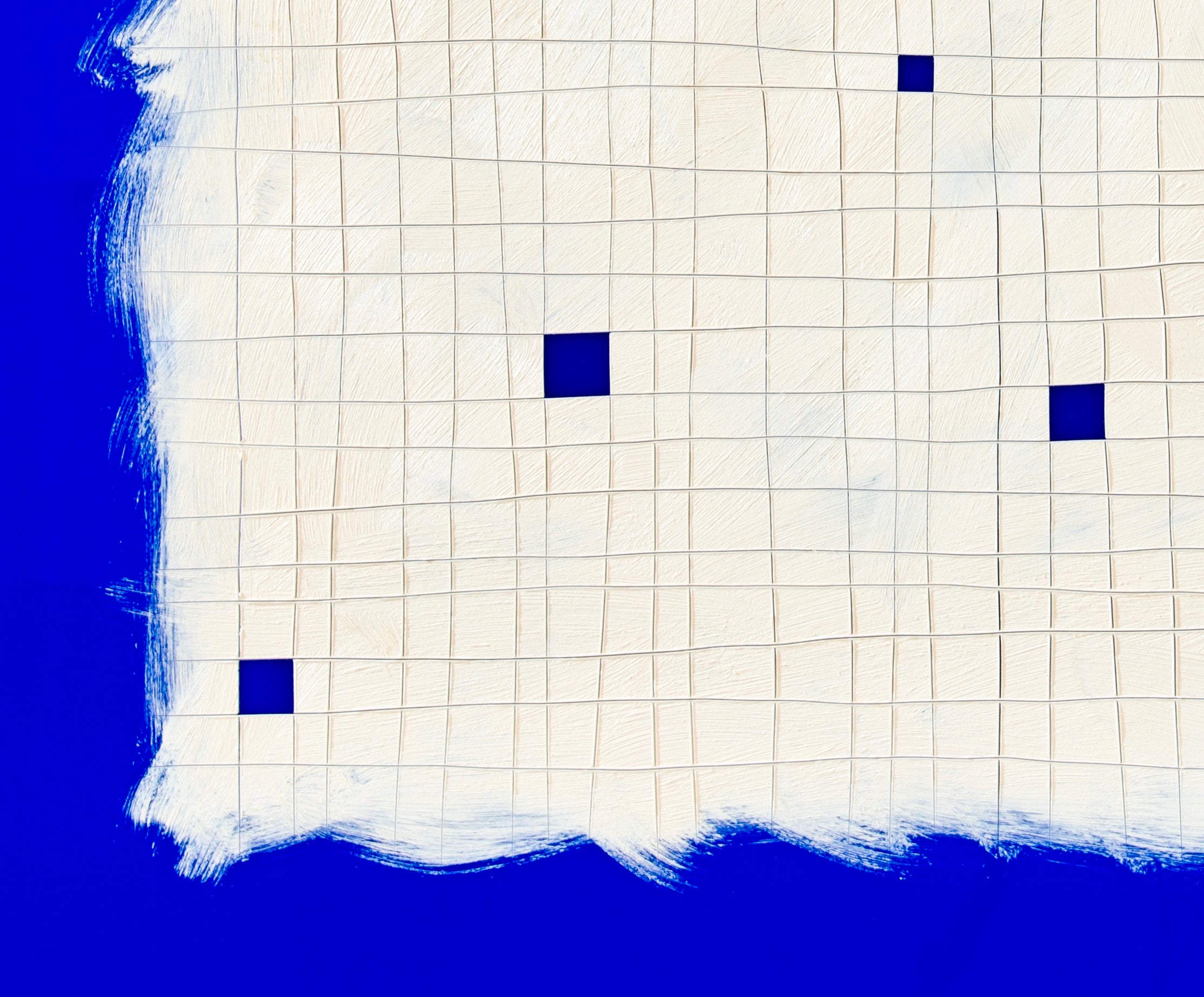 A piece of paper with blue squares on it.
