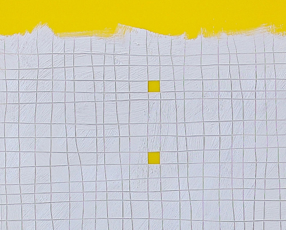 A piece of paper with yellow squares on it.