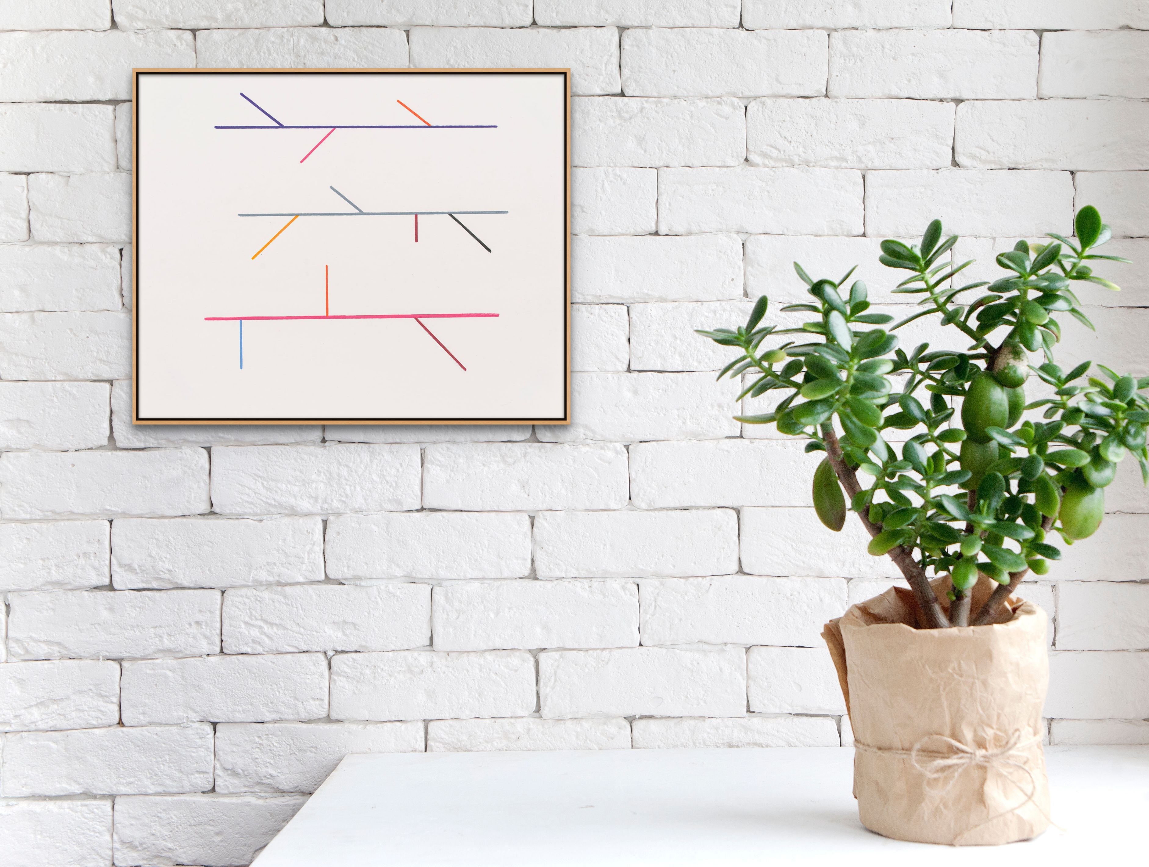 A white poster with three different colored lines on it.