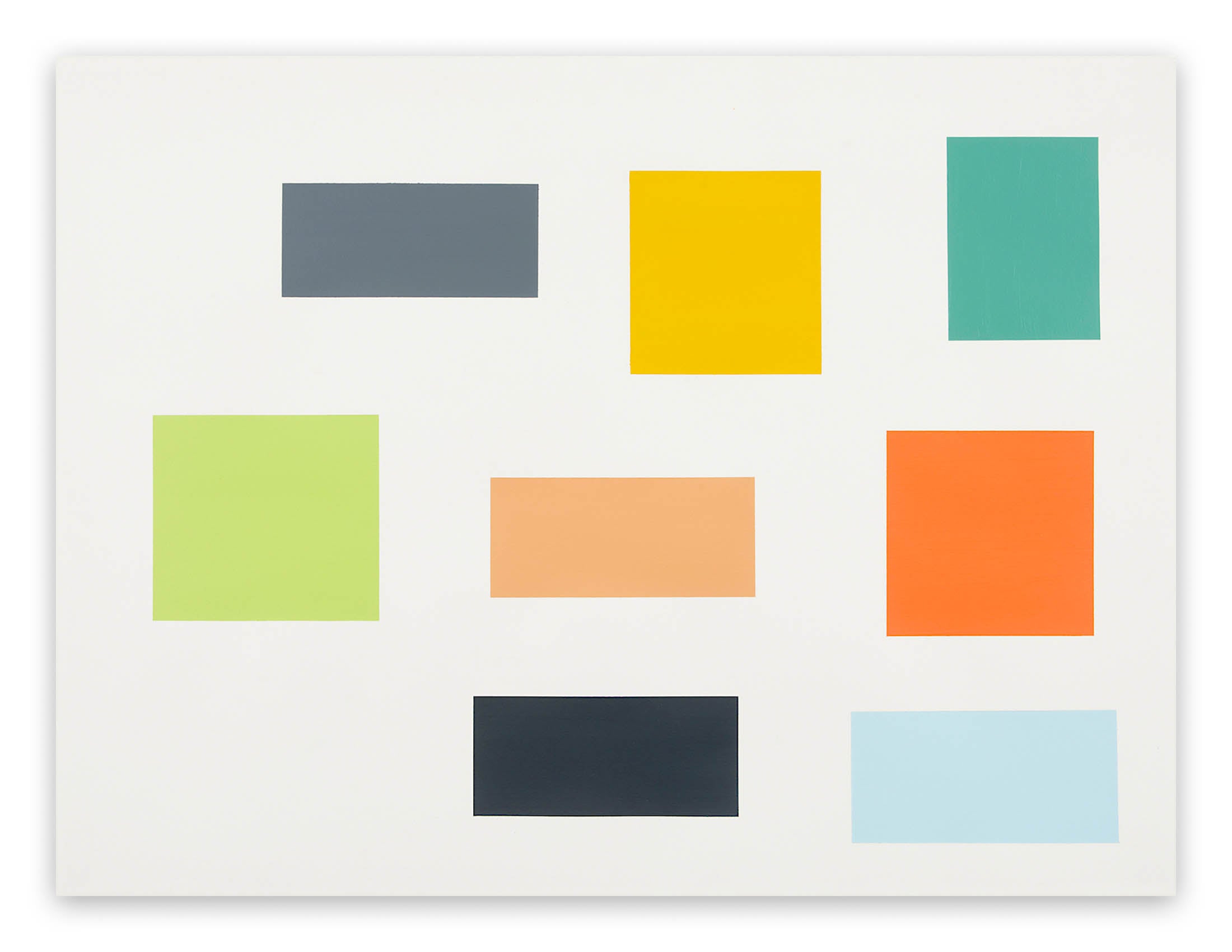 A white wall with a bunch of different colored squares on it.