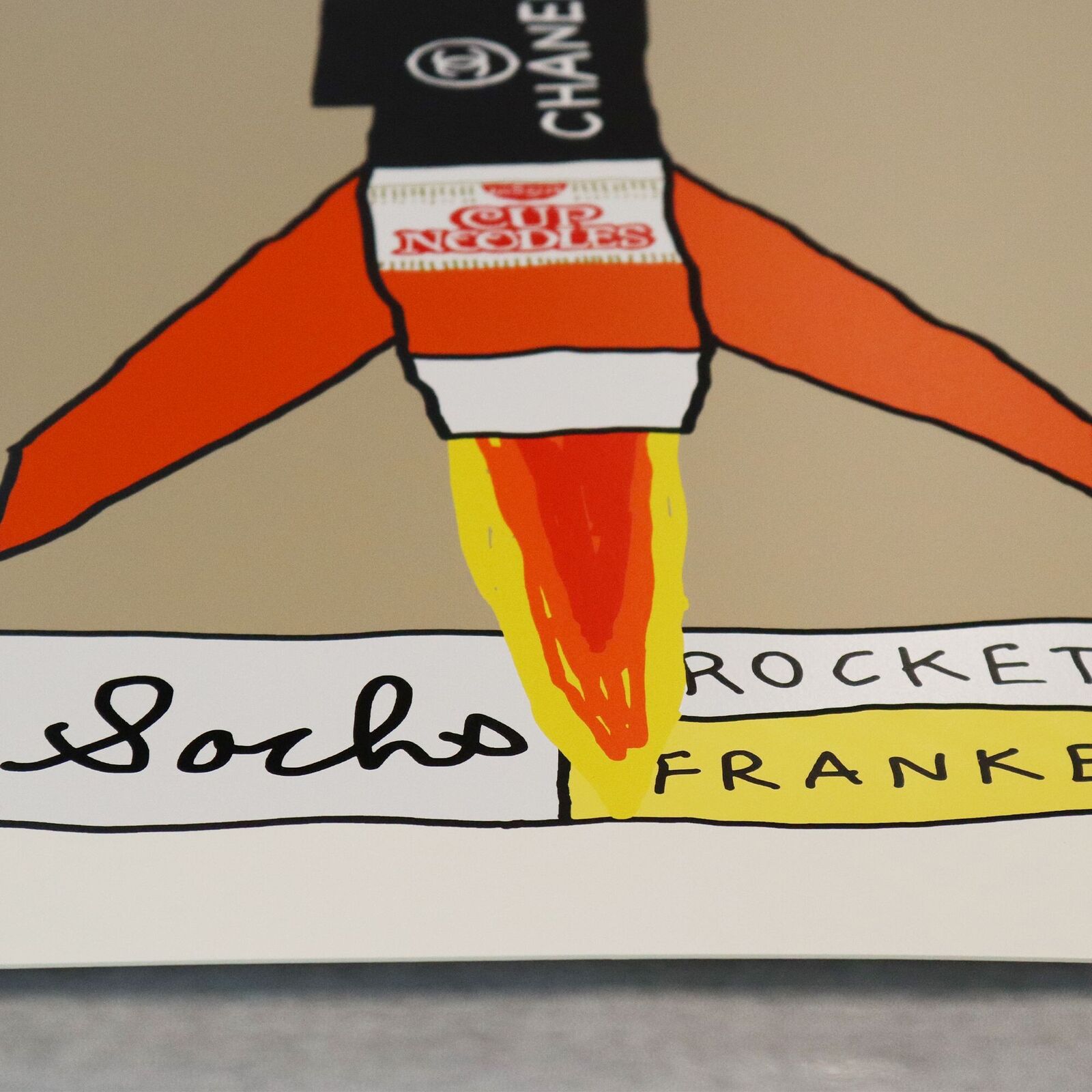 A drawing of a rocket with a chanel logo on it.