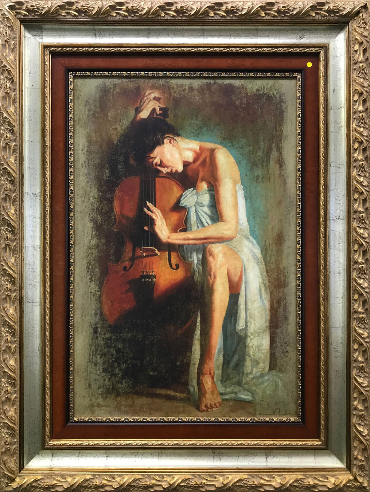 A painting of a woman playing a cello in a gold frame.