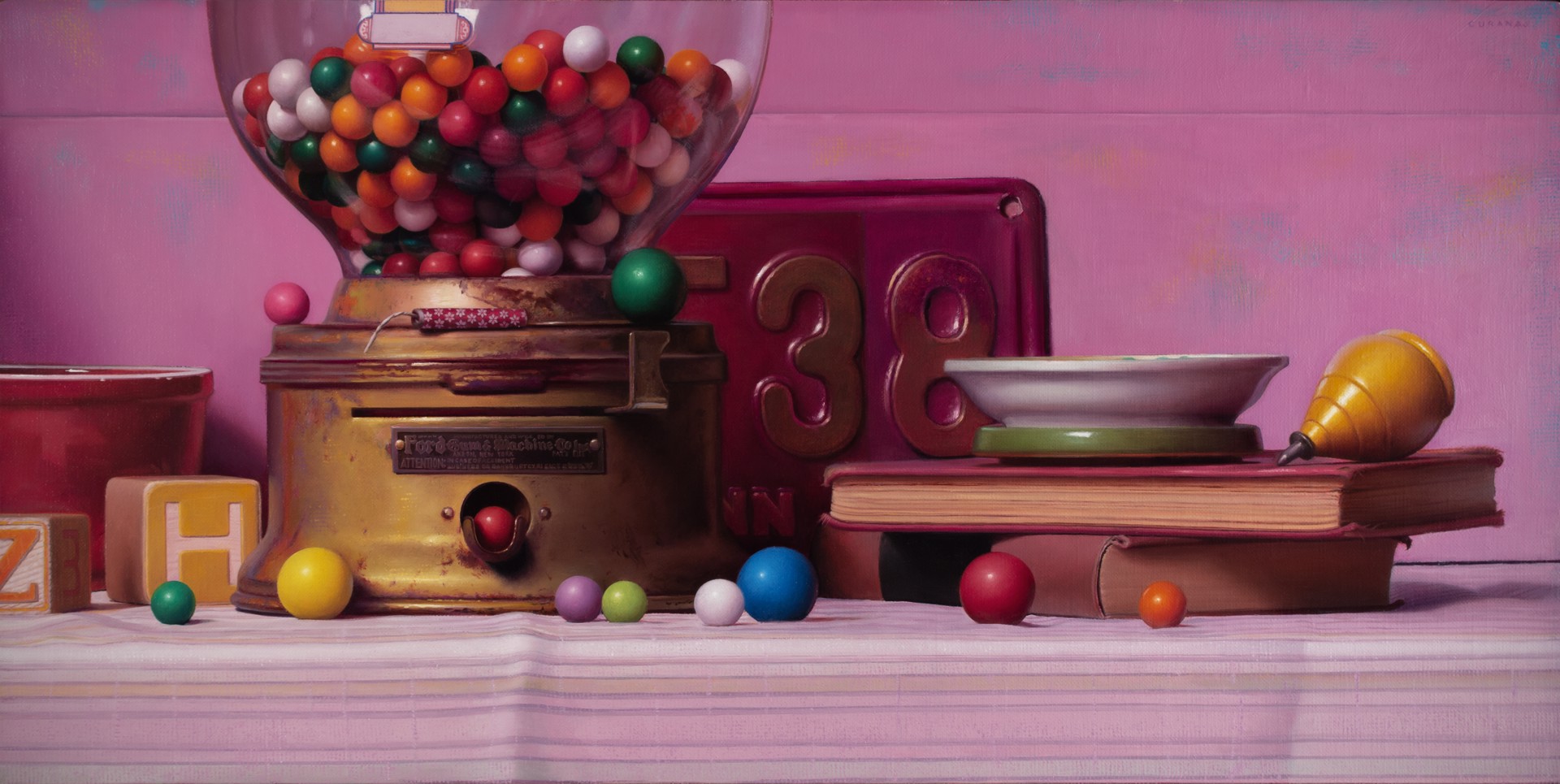 A colorful still life featuring a vintage gumball machine, books, and scattered spheres against a soft pink backdrop.
