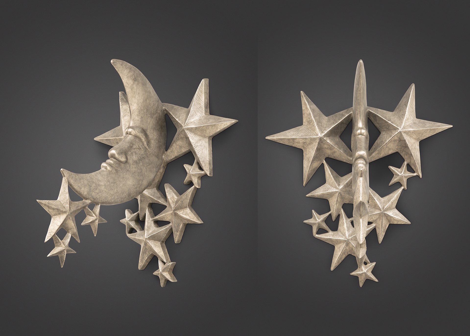 A pair of metallic wall sconces featuring celestial motifs like a crescent moon and stars.