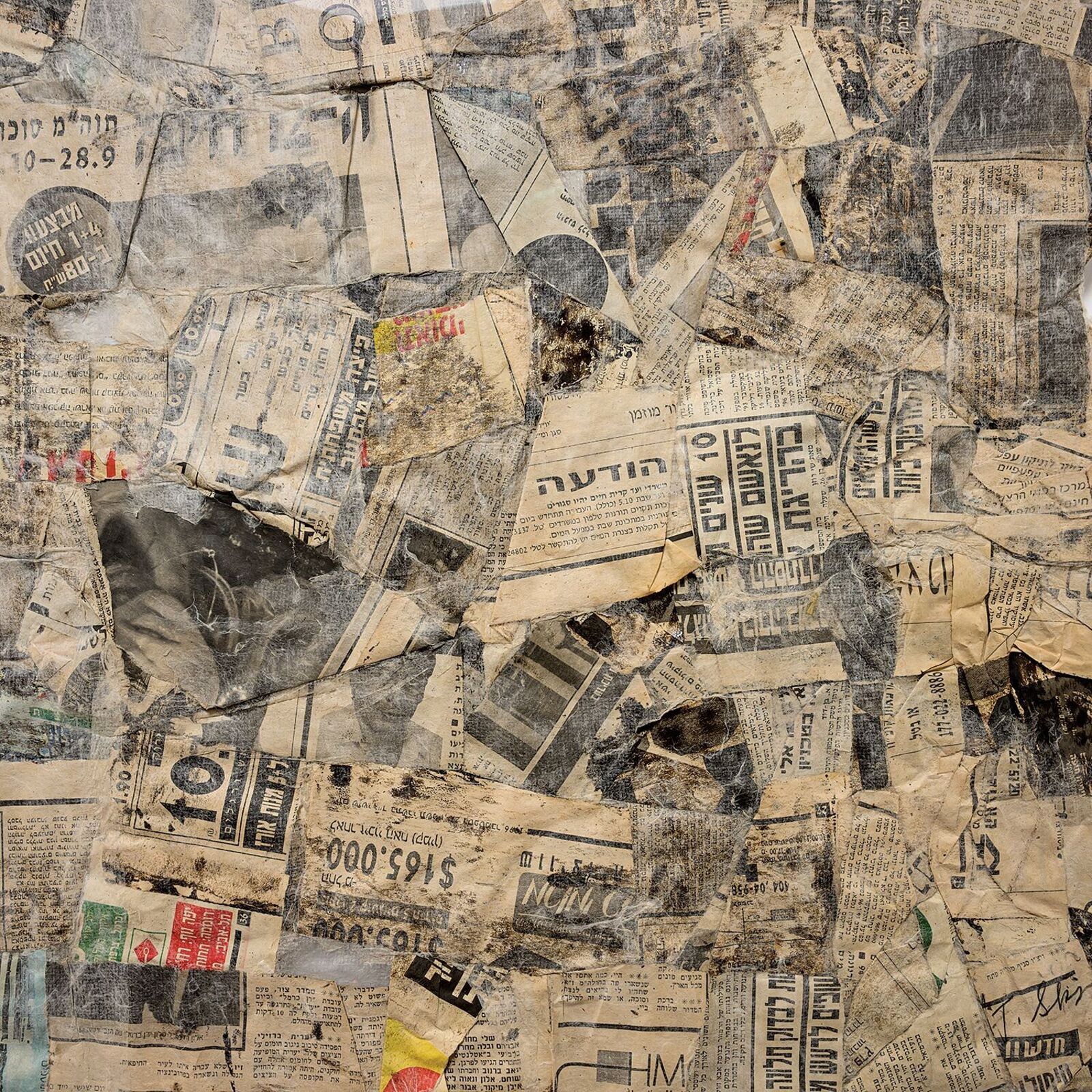 A framed collage of aged, torn paper fragments arranged in a rough square shape.