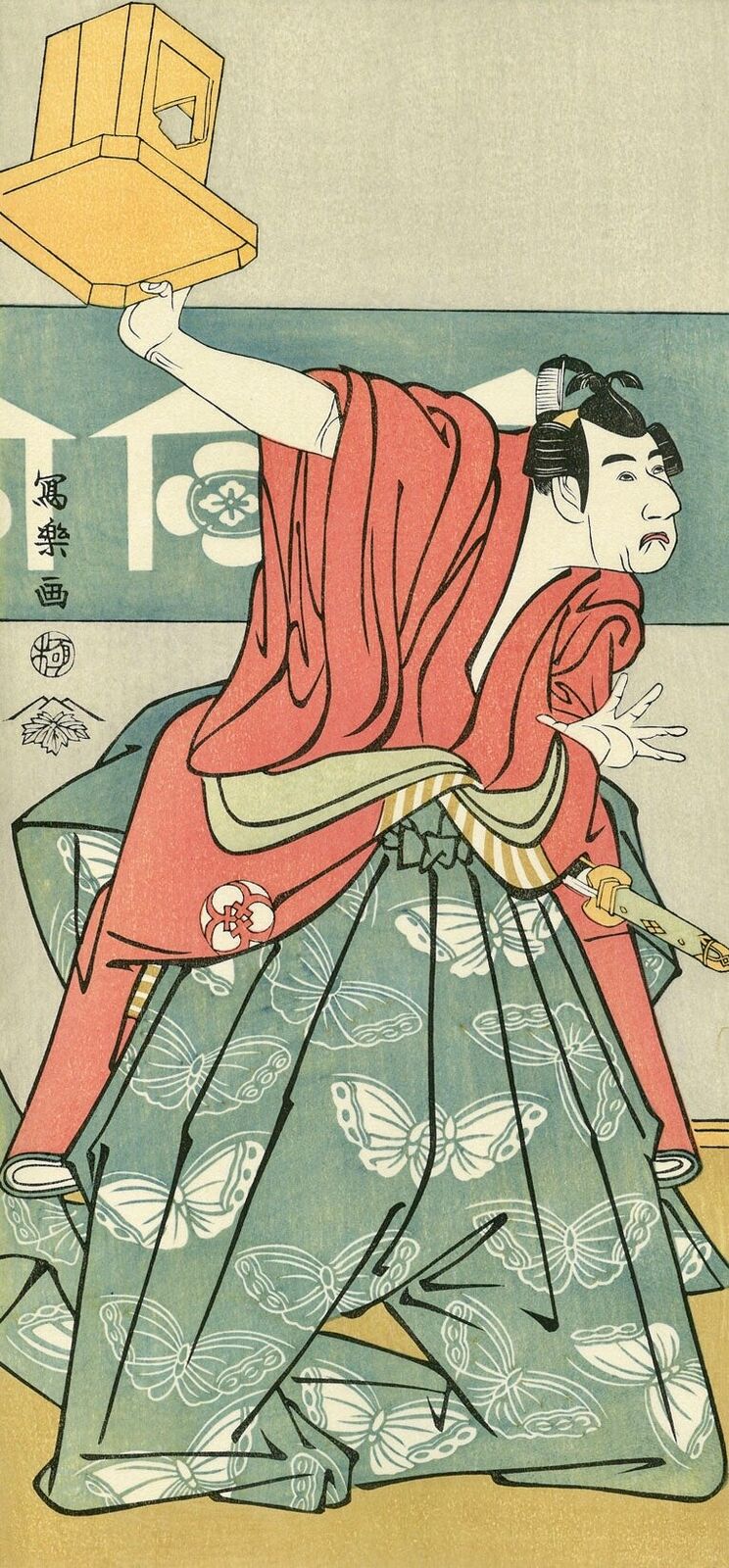 A woman in a kimono holding a lantern in her hand.