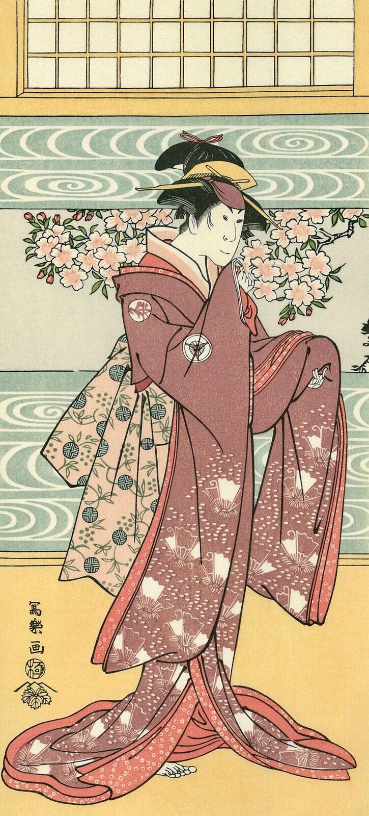 A woman in a kimono standing in front of a window.