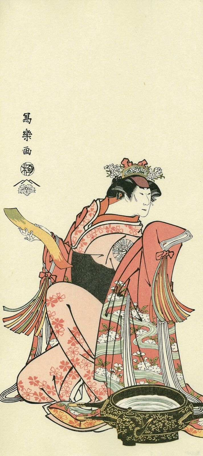 A woman in a kimono sitting on the ground with a fan.
