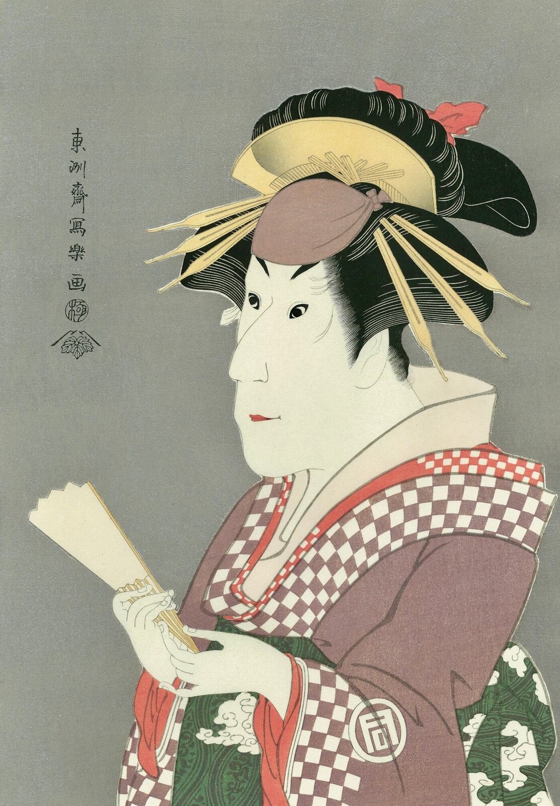 A woman in a kimono holding a fan and a piece of paper.