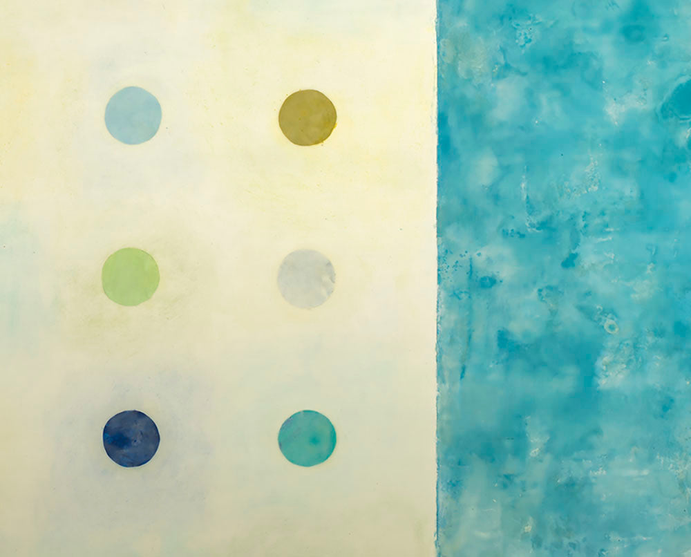 A painting of blue and yellow polka dots on a white background.
