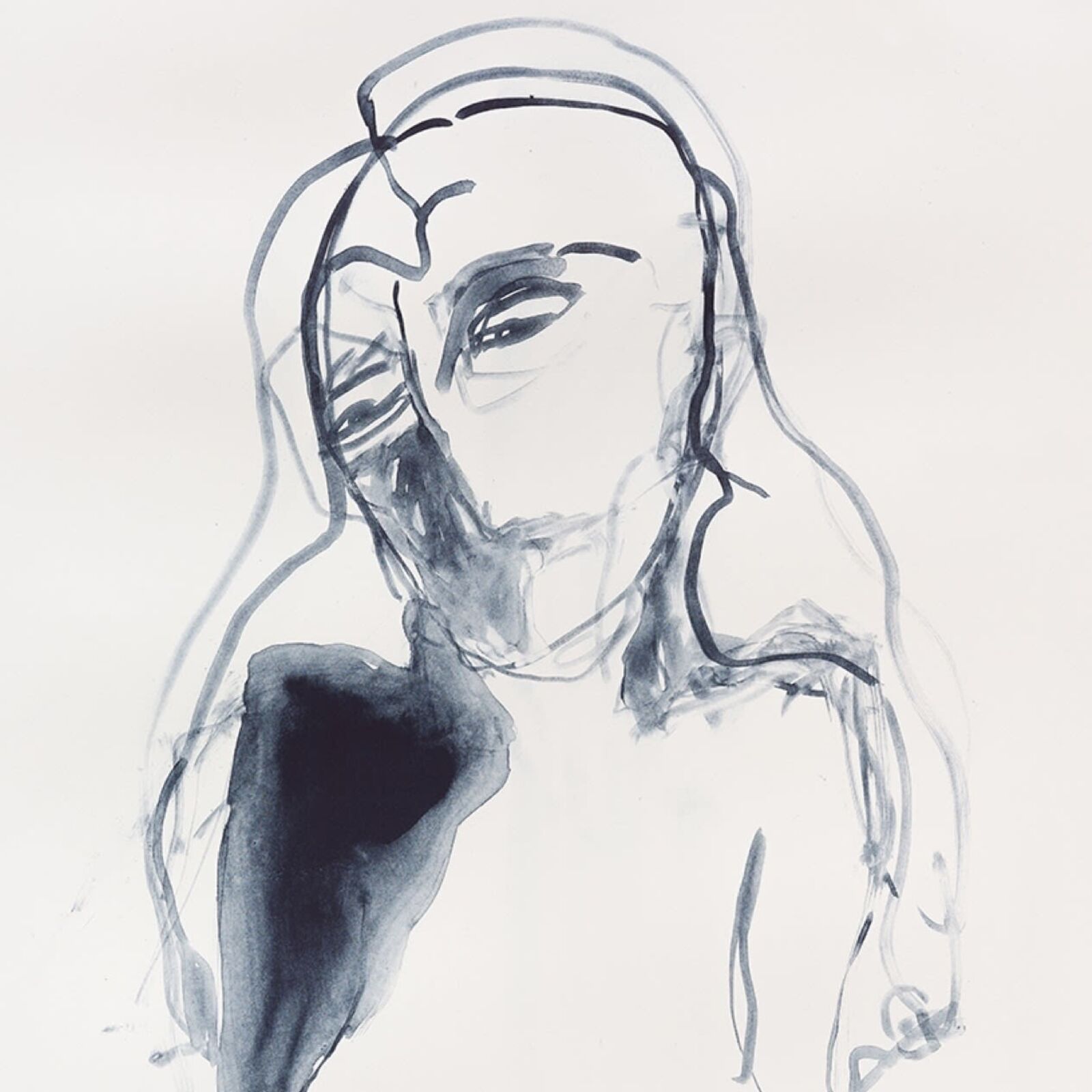 A black and white drawing of a woman's face on a white wall.