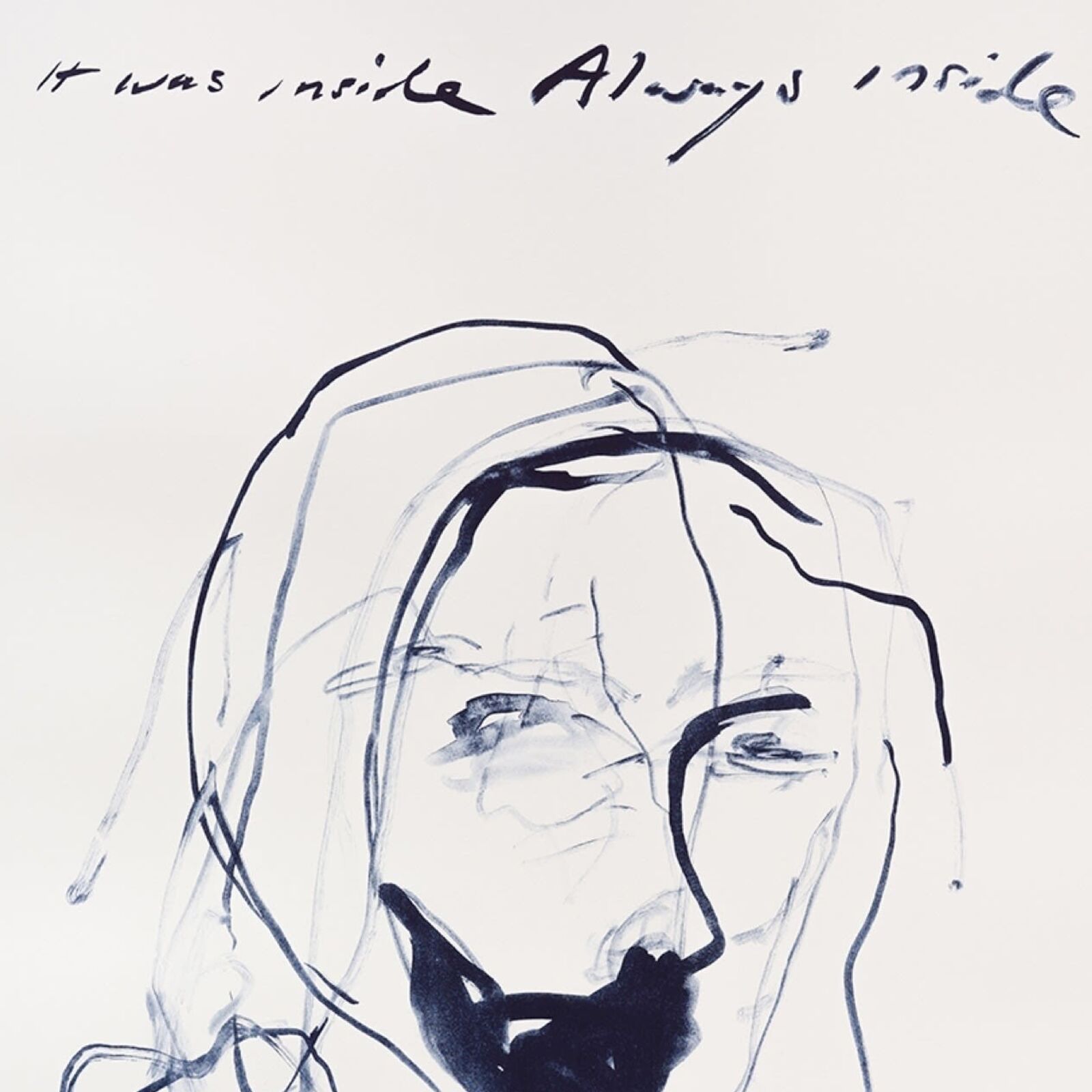 A black and white drawing of a woman's face on a wall.