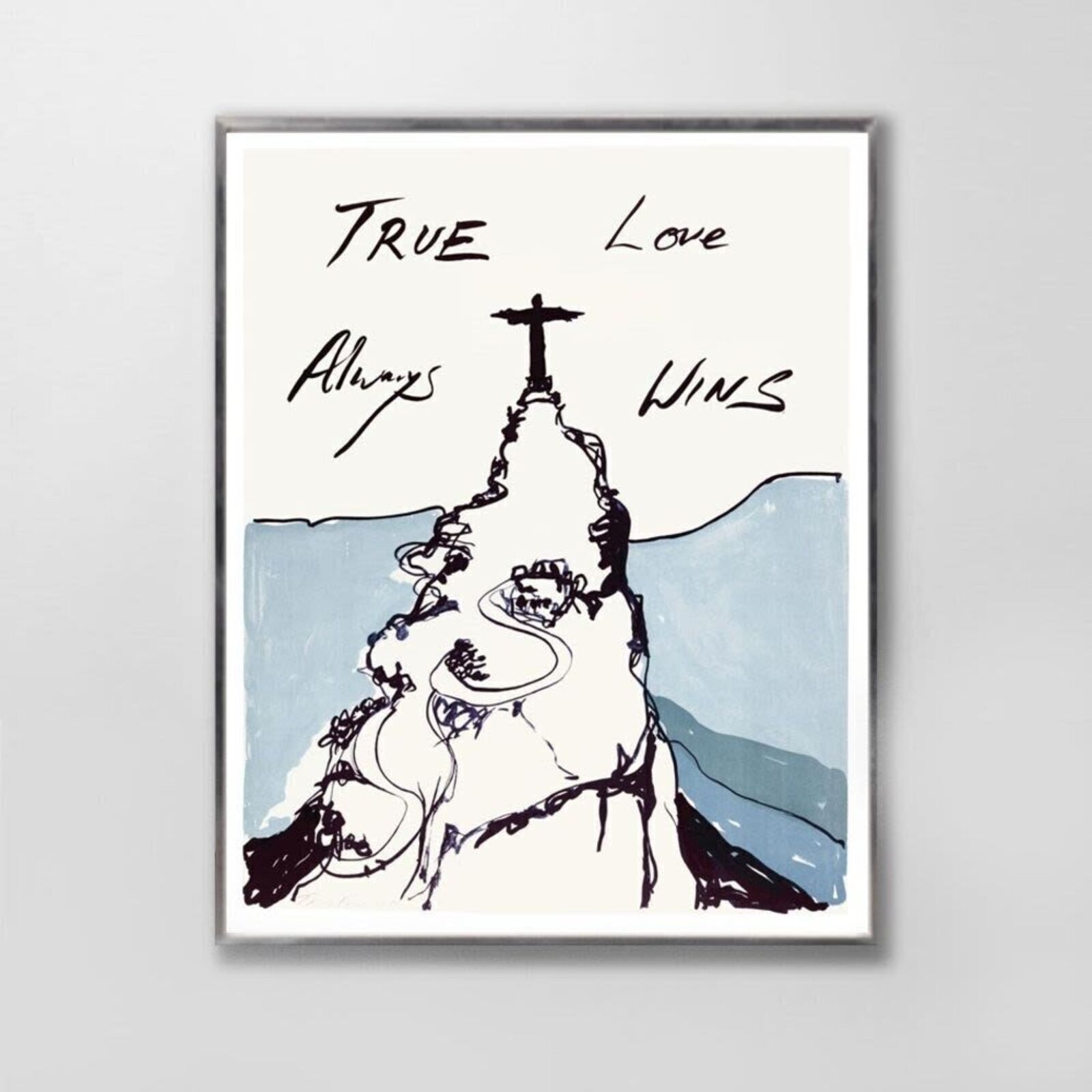 A framed print featuring a stylized mountain with a cross on top and the text 'True Love Always Wins'.