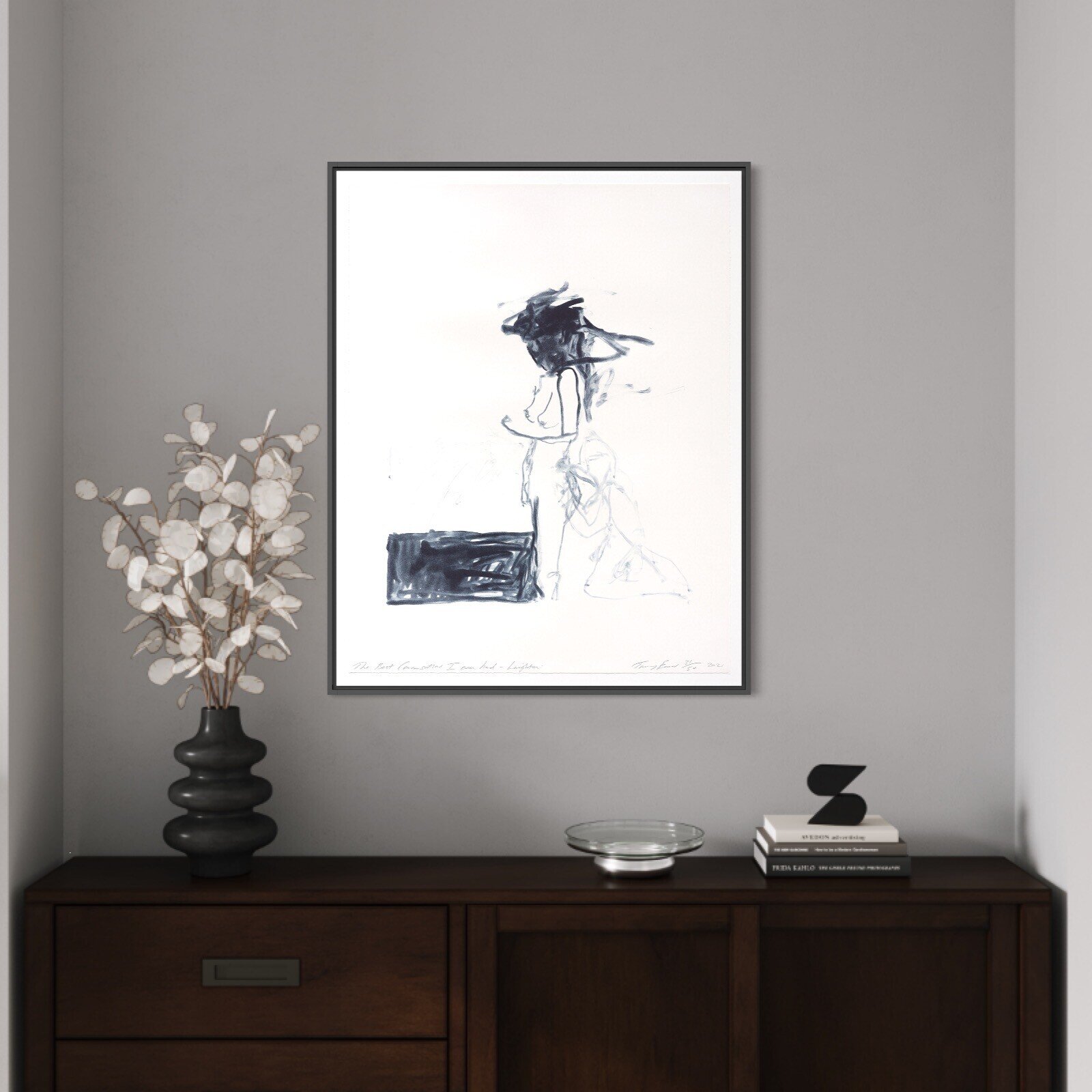 A minimalist ink sketch of a seated figure with a dark, abstract head against a stark white background.