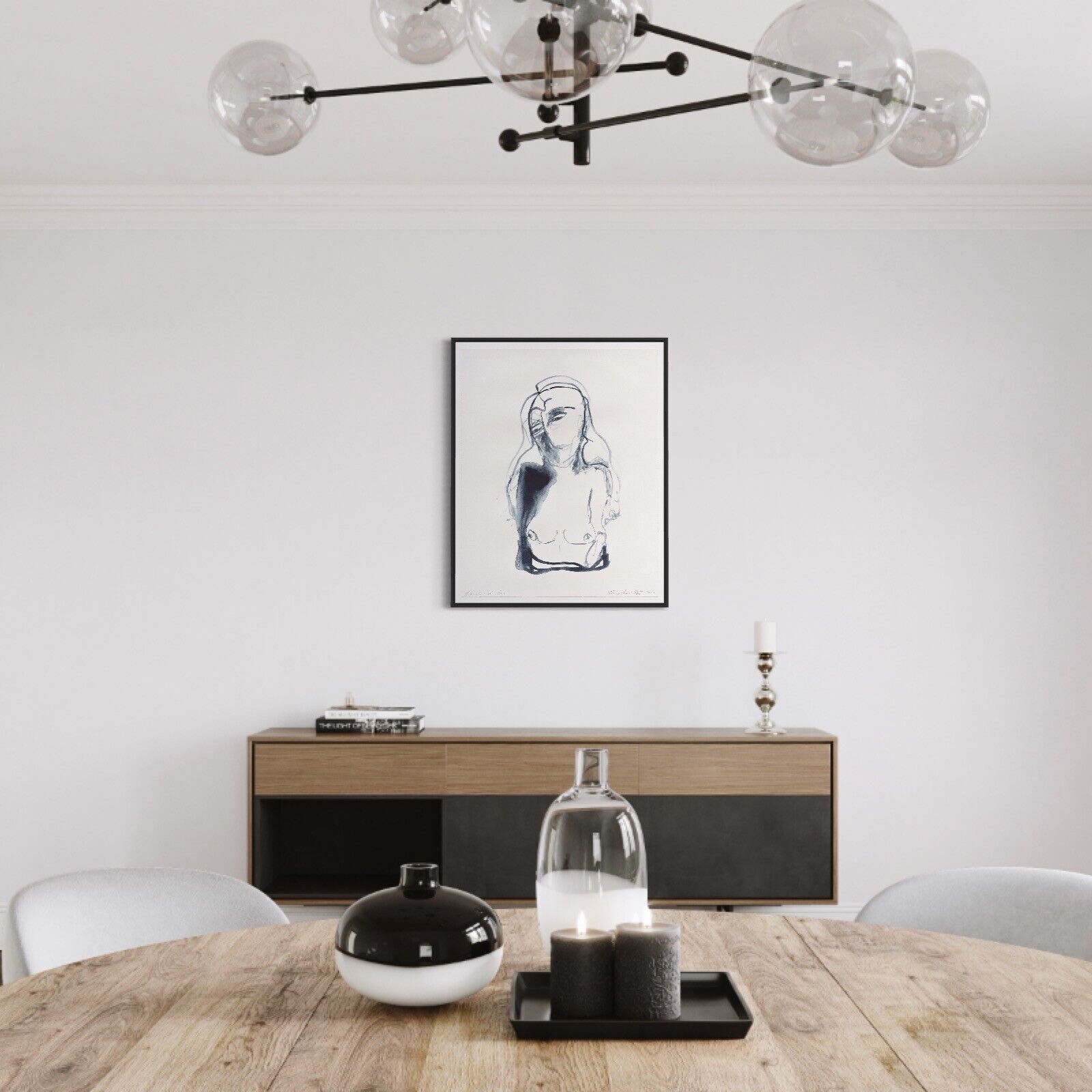 A modern interior scene featuring a minimalist line drawing of a figure on the wall, flanked by two armchairs and a round wire table.