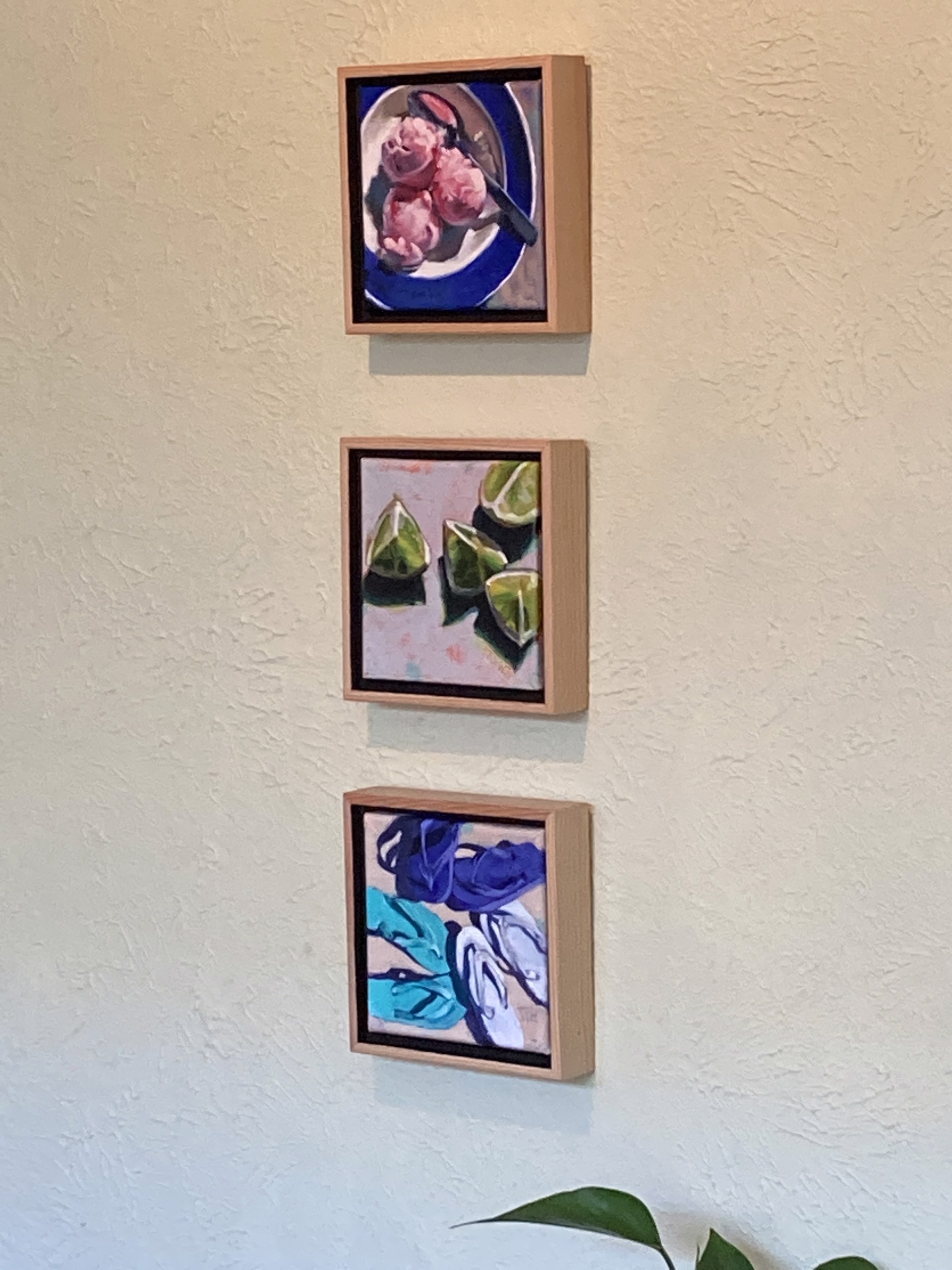A painting of three pairs of flip flops on a beige background.