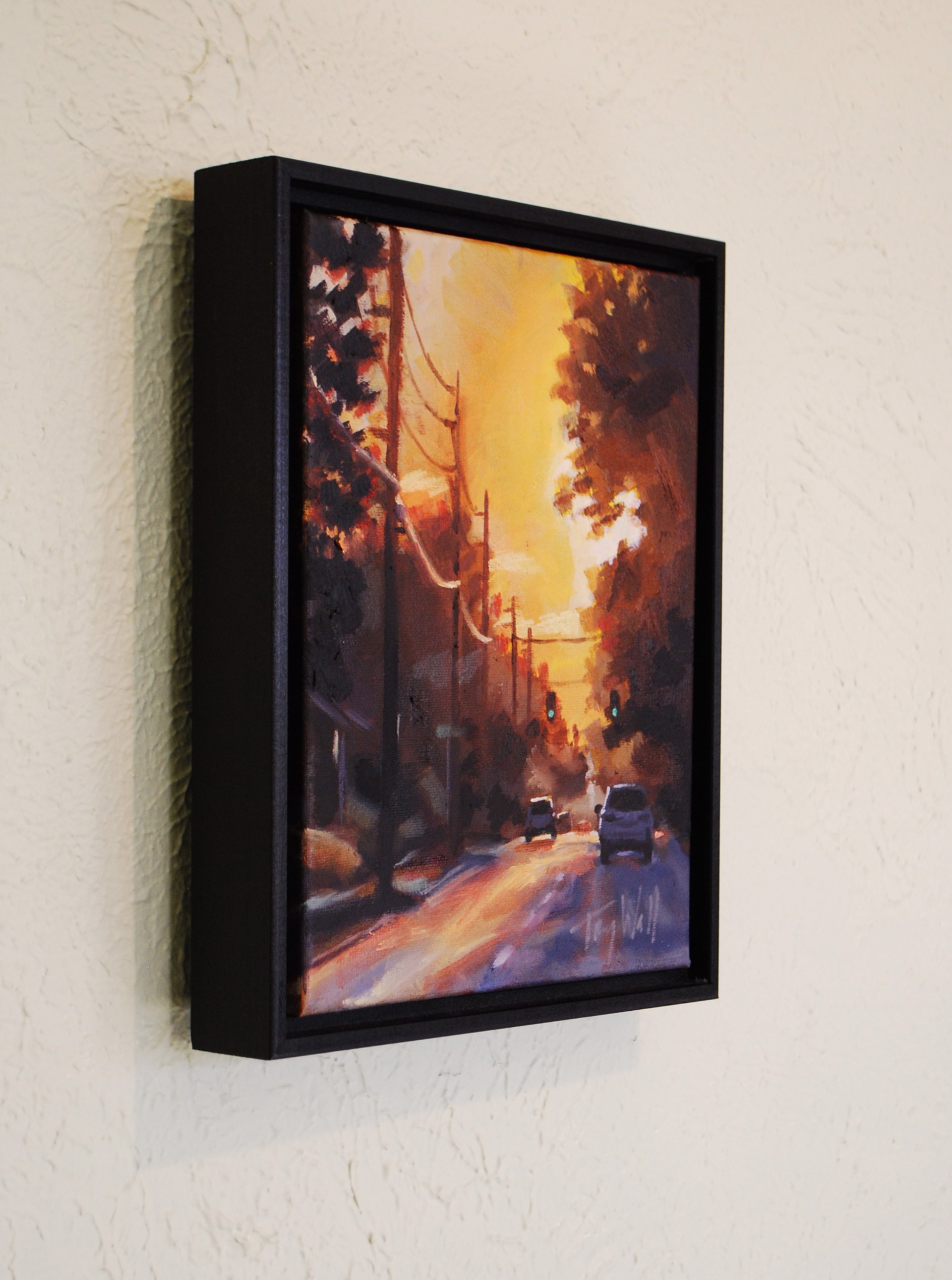 A painting of a street scene with cars driving down the road.