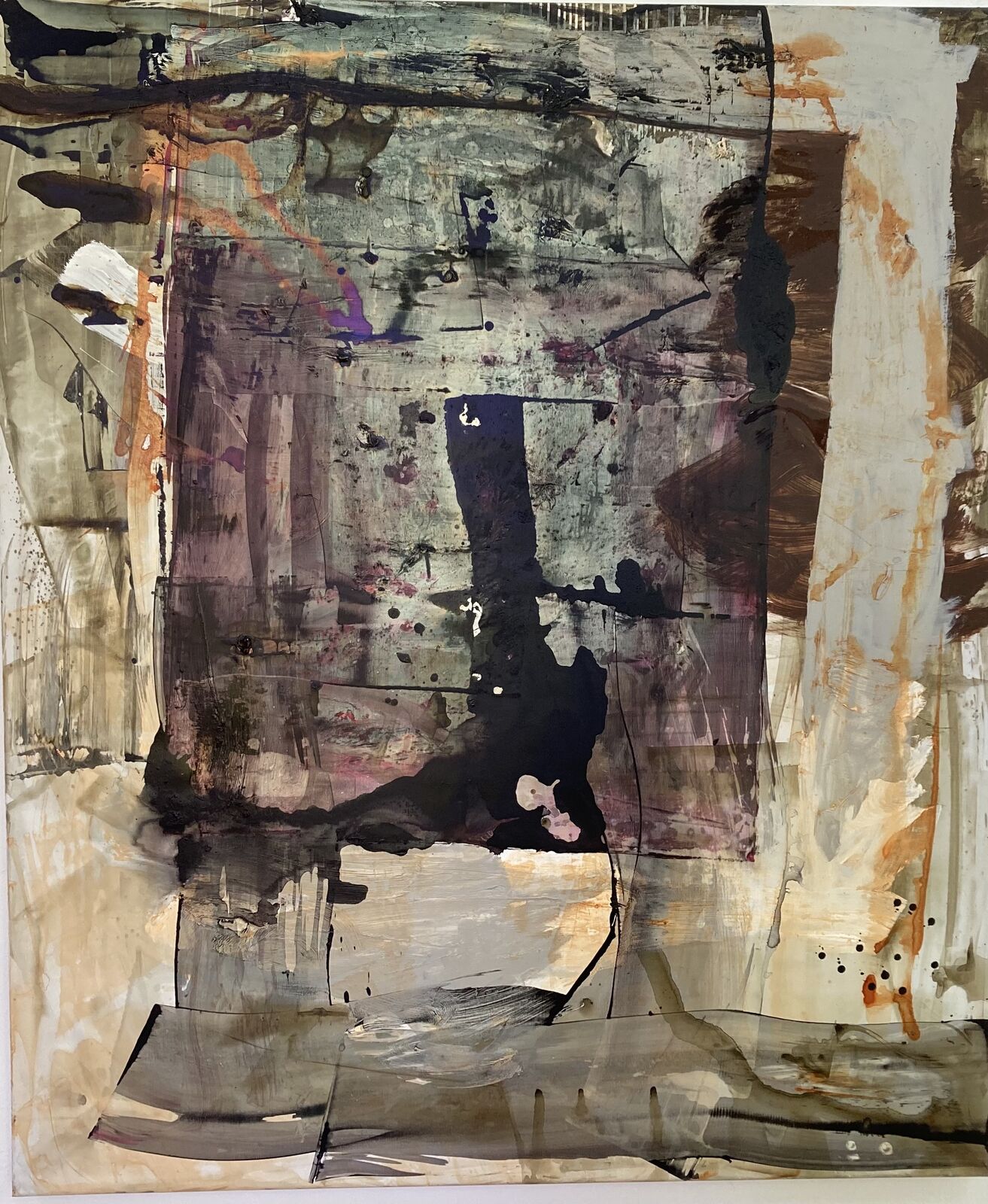 A painting on a white wall with a black and brown design.