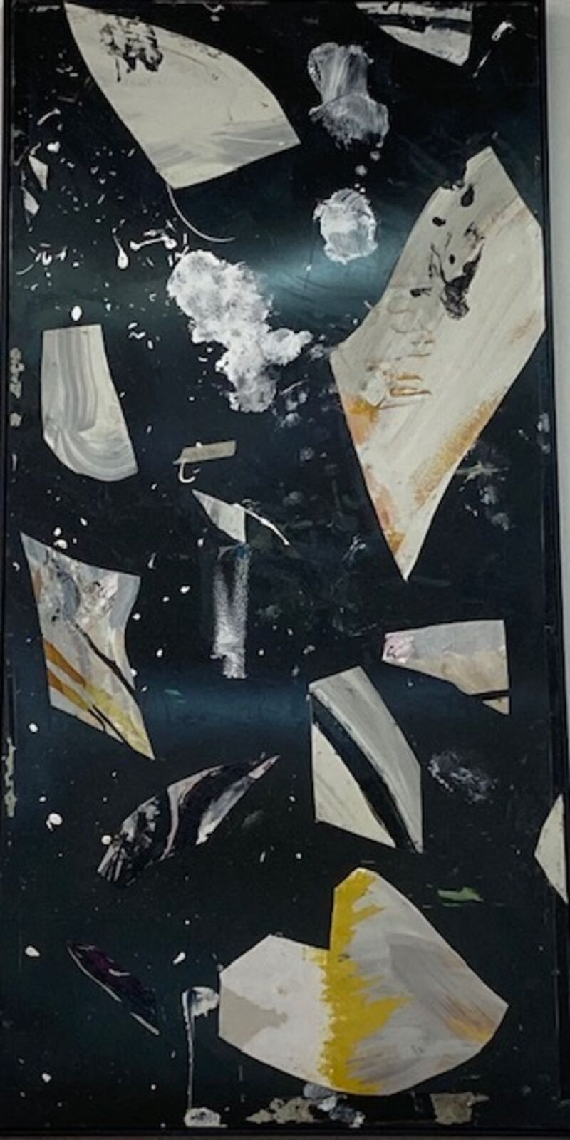 A black and white painting on a black wall.