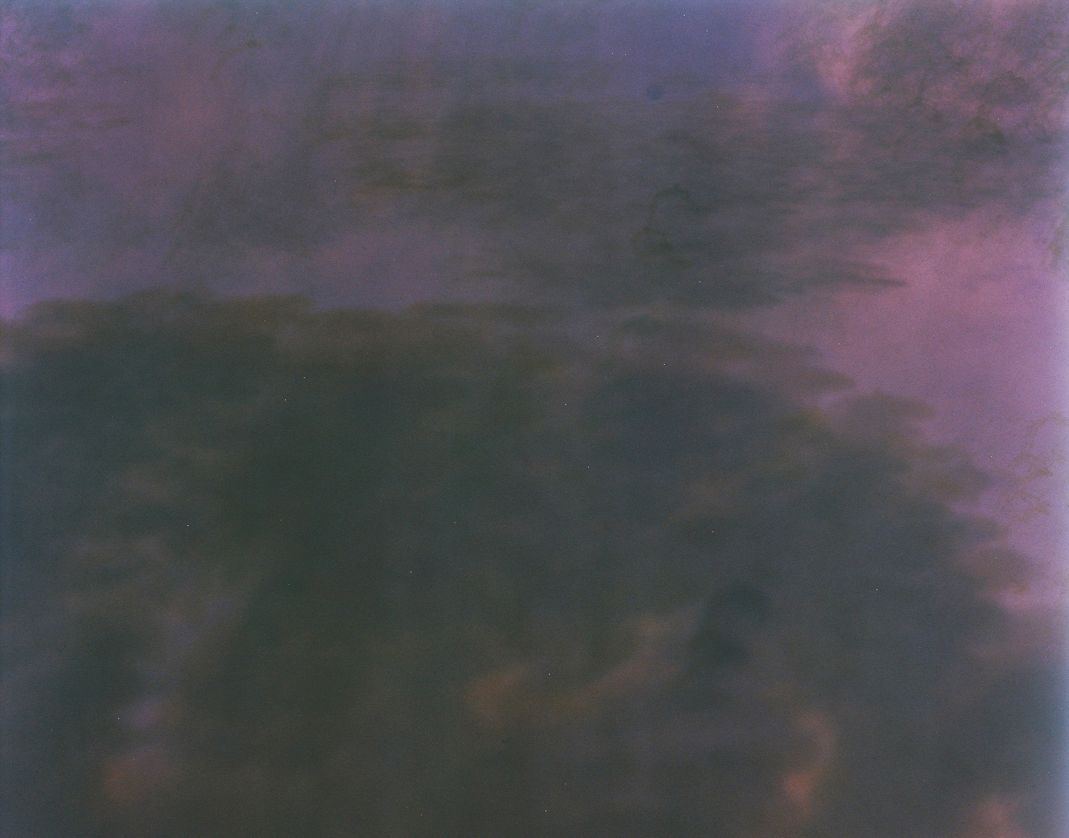 A picture of a purple sky with clouds in it.