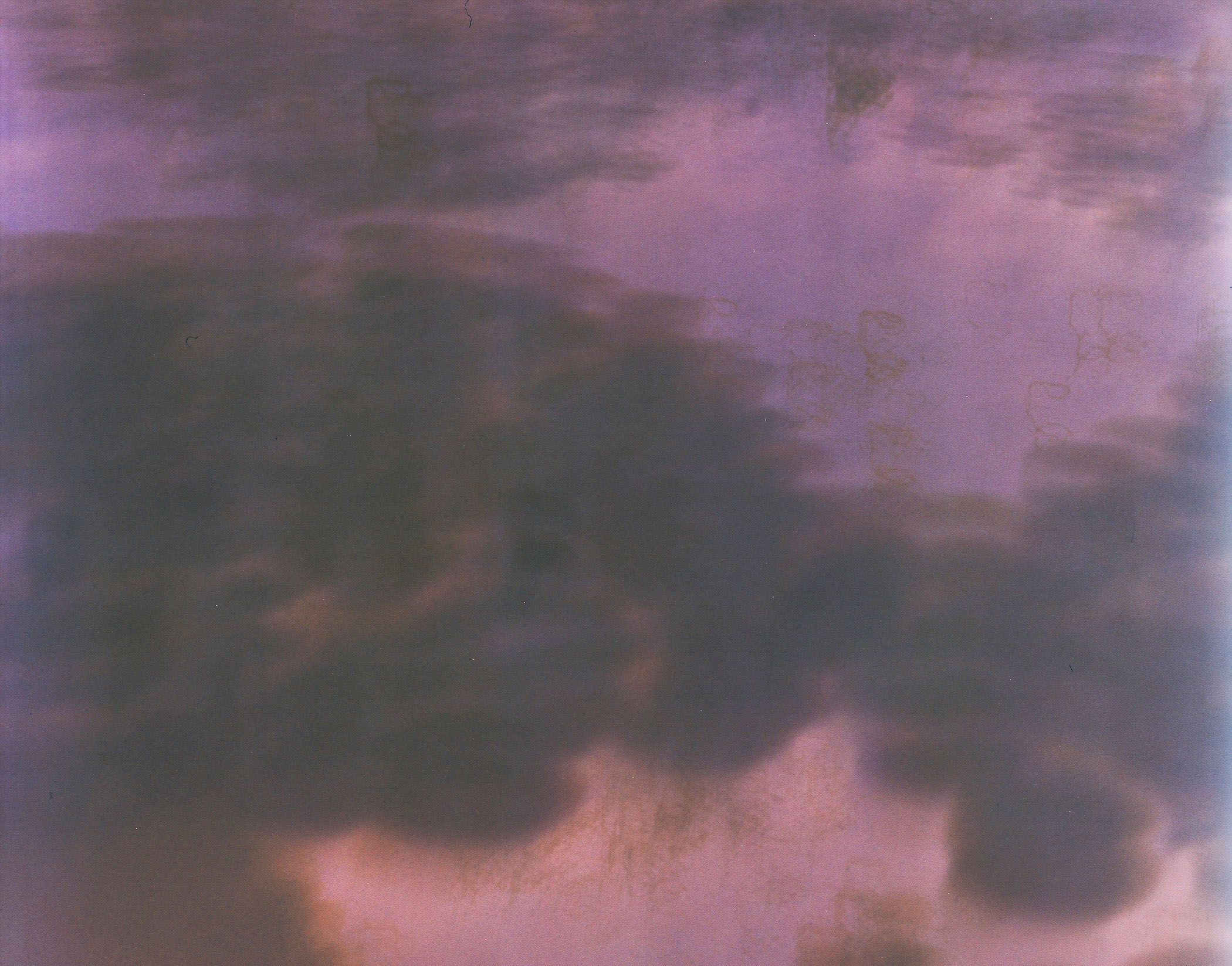 A picture of a purple sky with clouds in it.