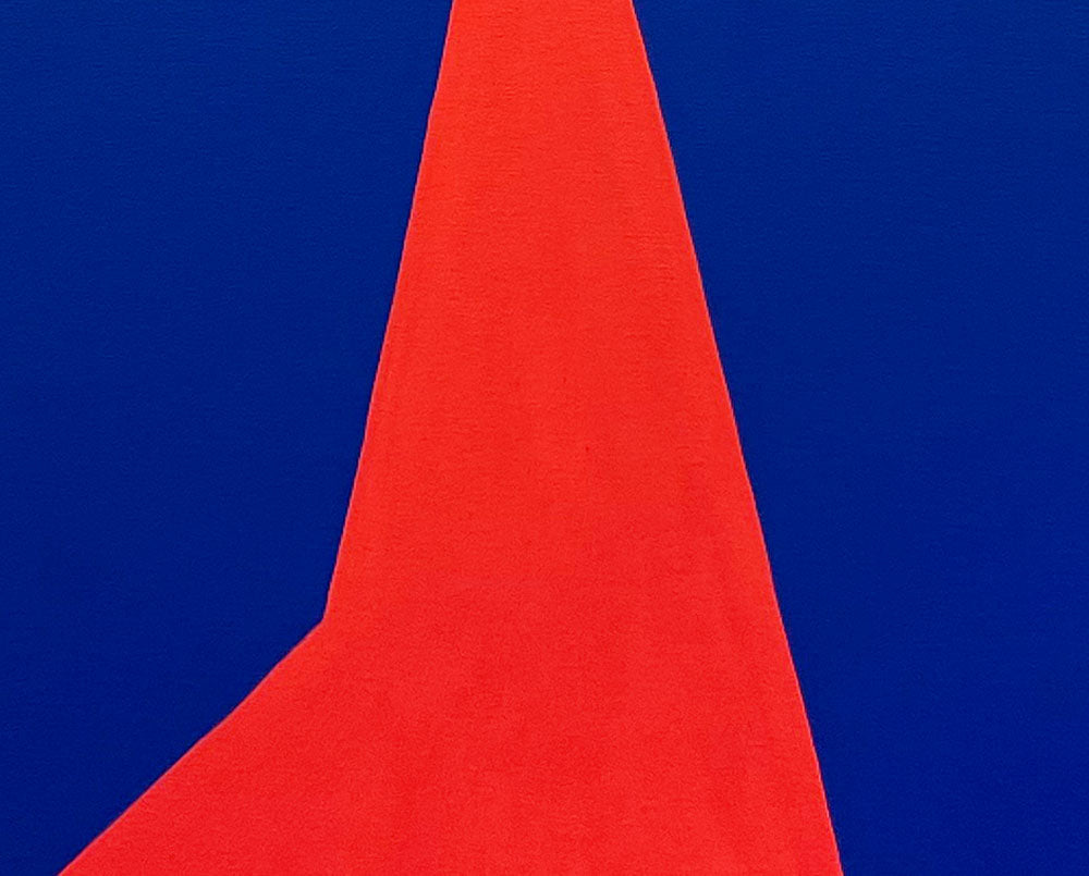A red triangle on a blue background. 