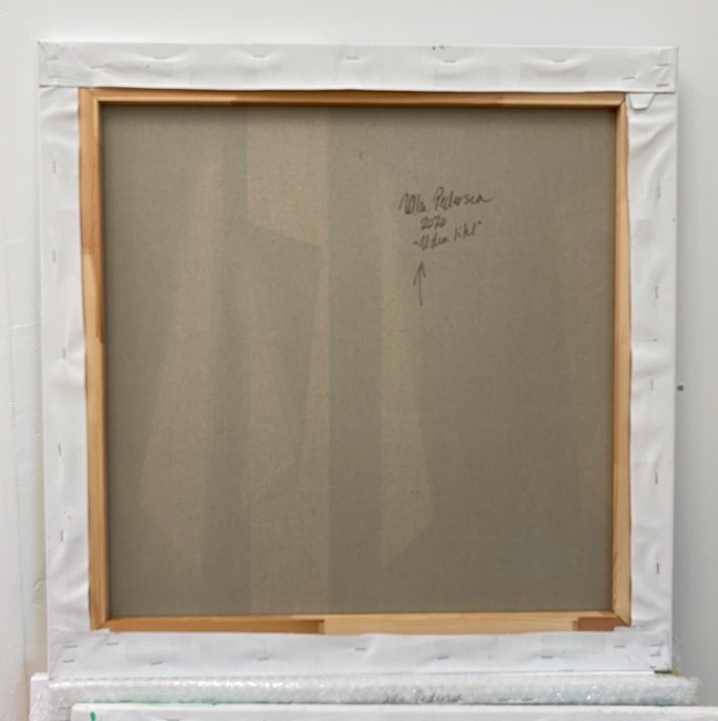 A painting of black and white shapes on a green background.