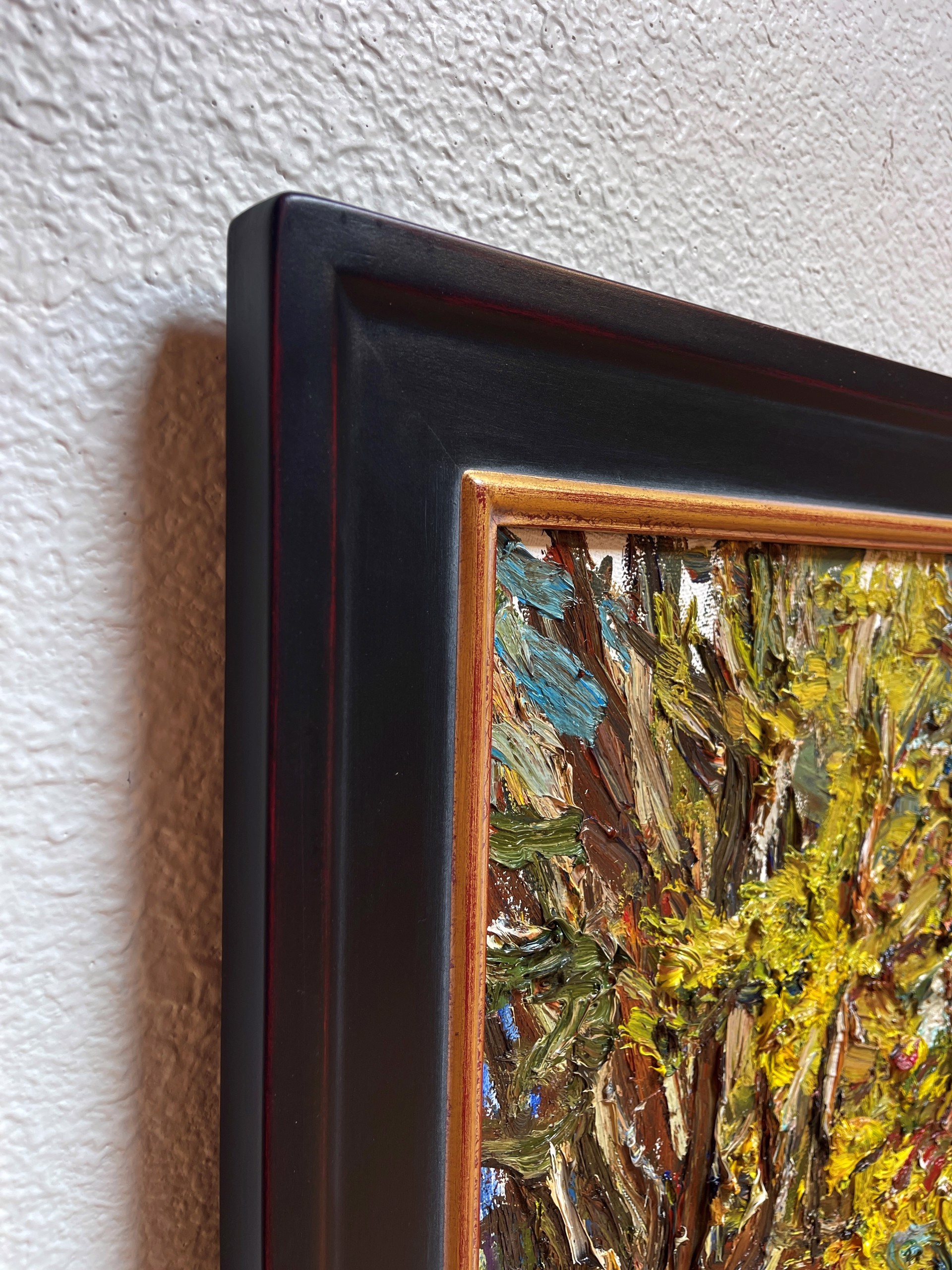 A thickly painted landscape featuring a vibrant, textured tree with bold strokes of yellow and green.