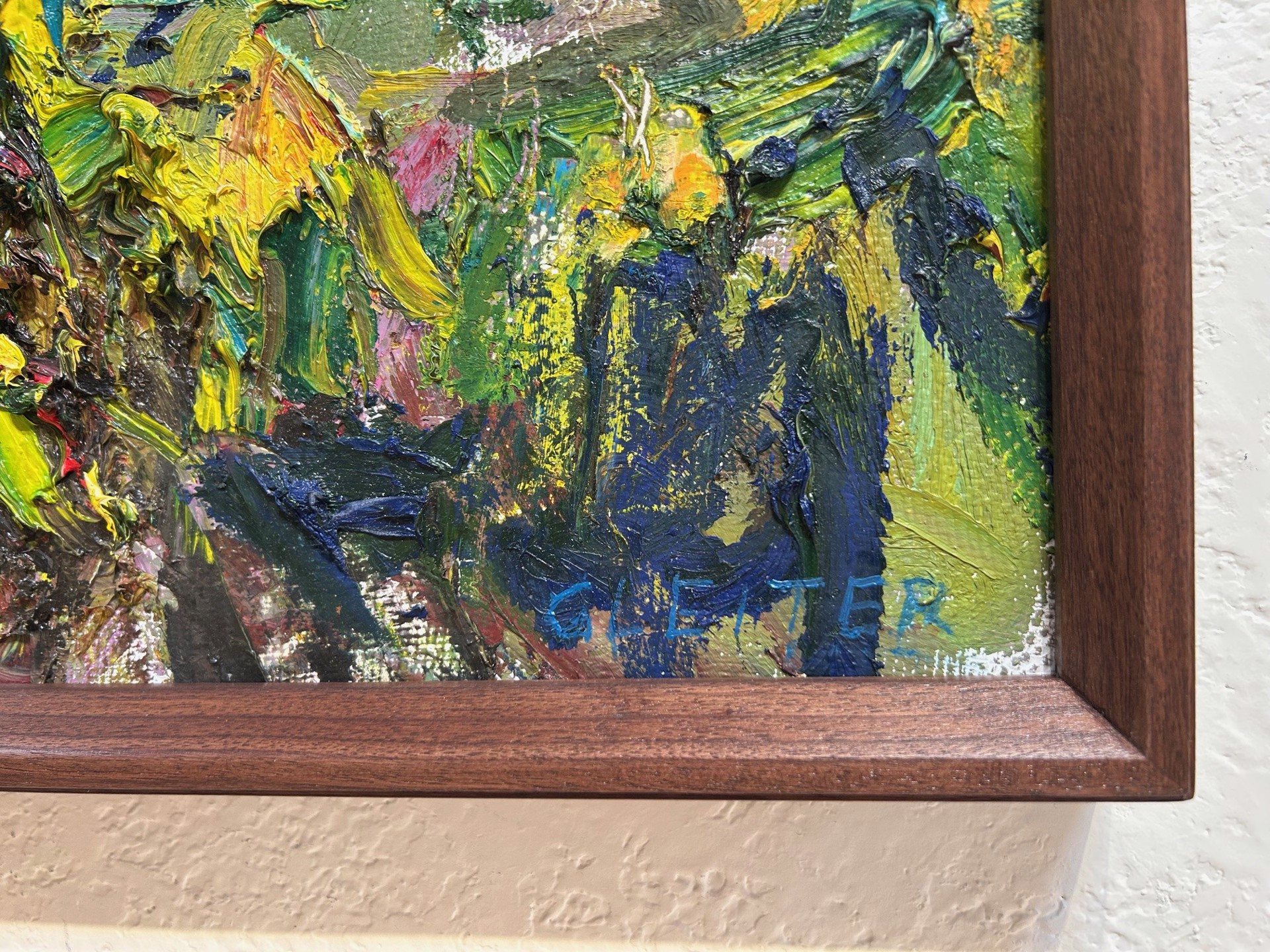 A painting of a landscape with trees and mountains in the background.