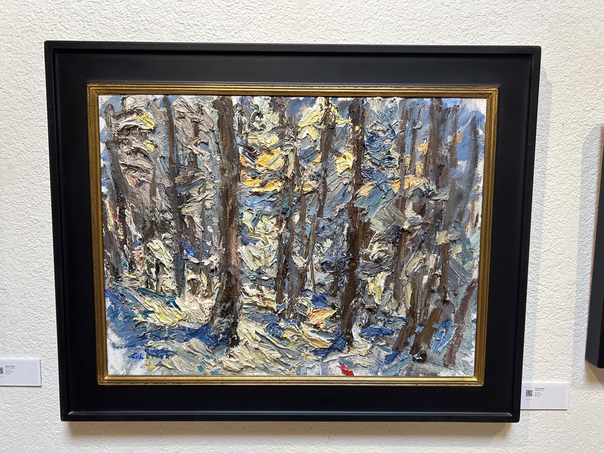 A painting of a forest with trees in the background.