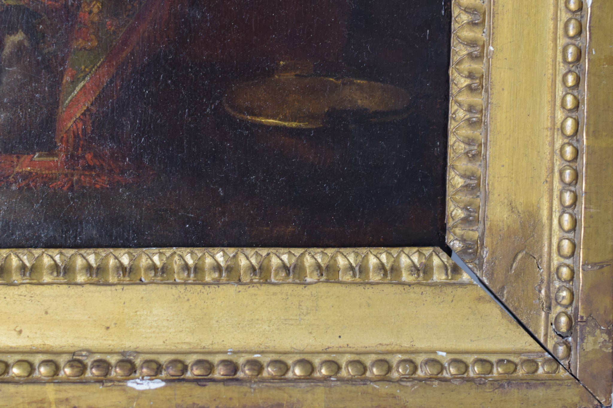 A painting of a woman sitting on a couch with two children.