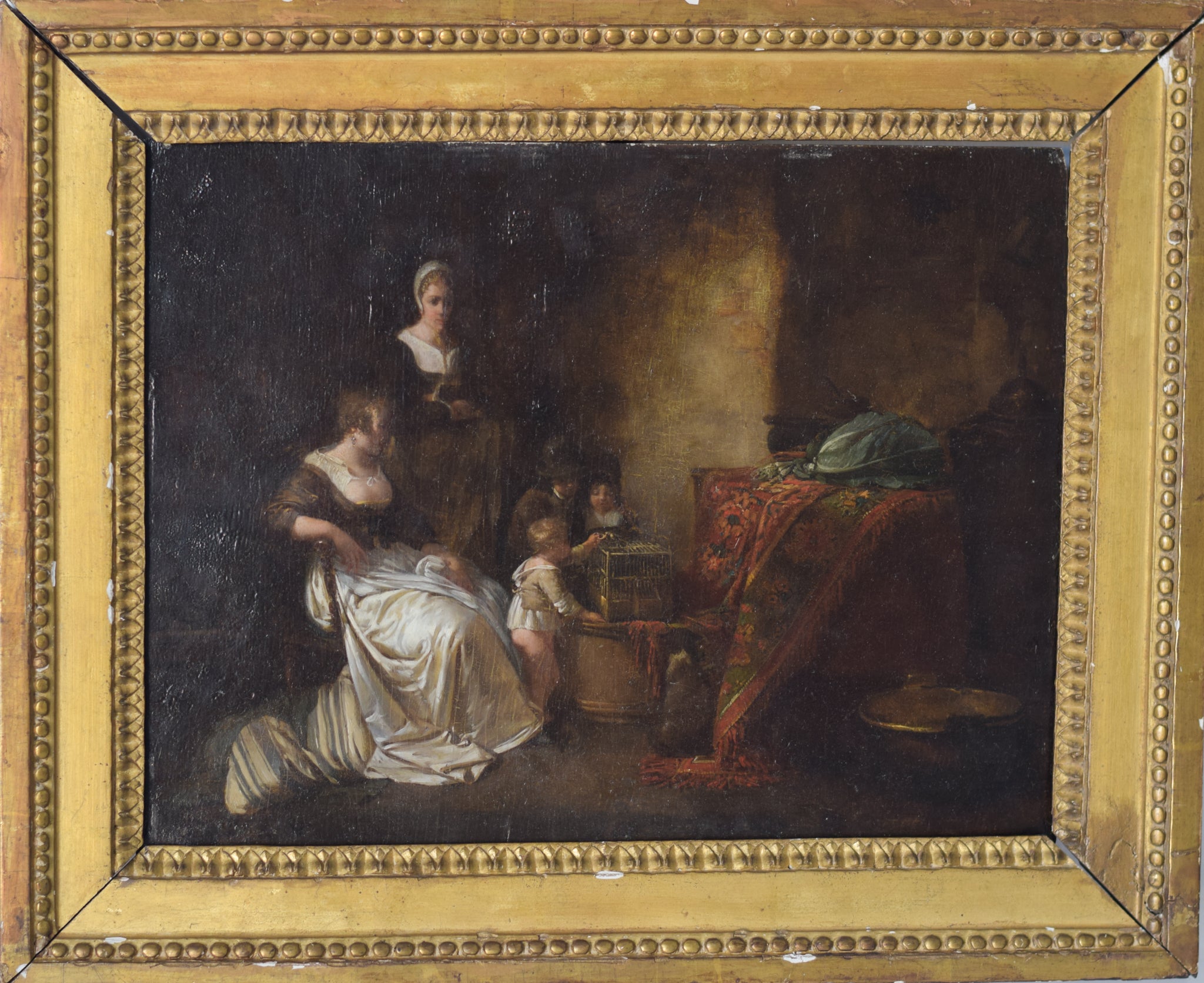 A painting of a woman sitting on a couch with two children.