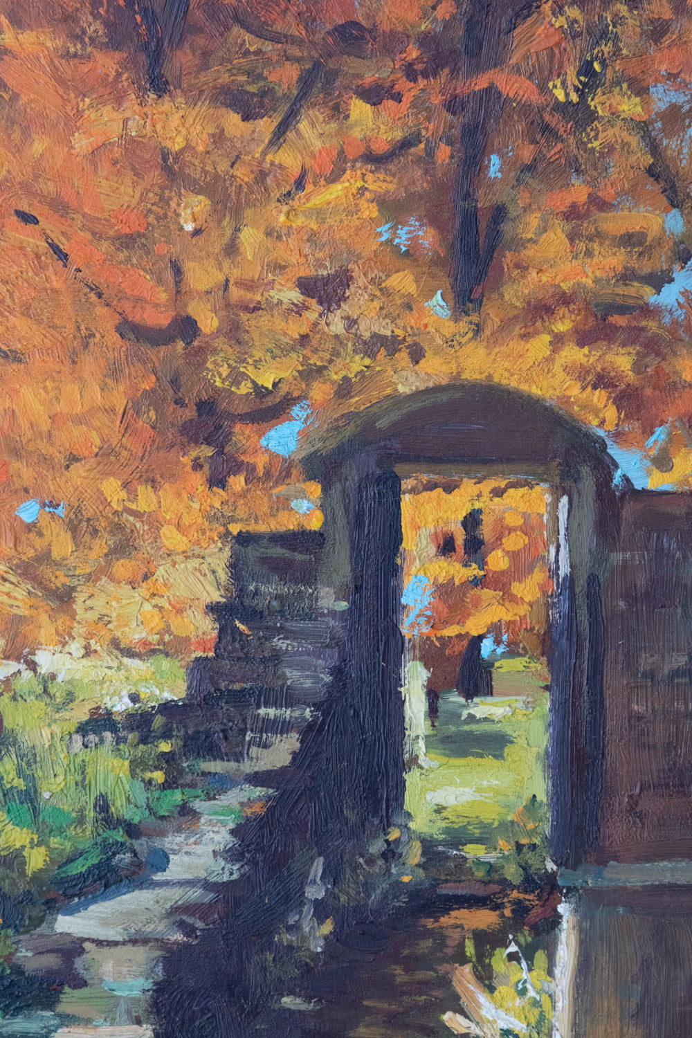 A painting of a stone bridge in the middle of a park.
