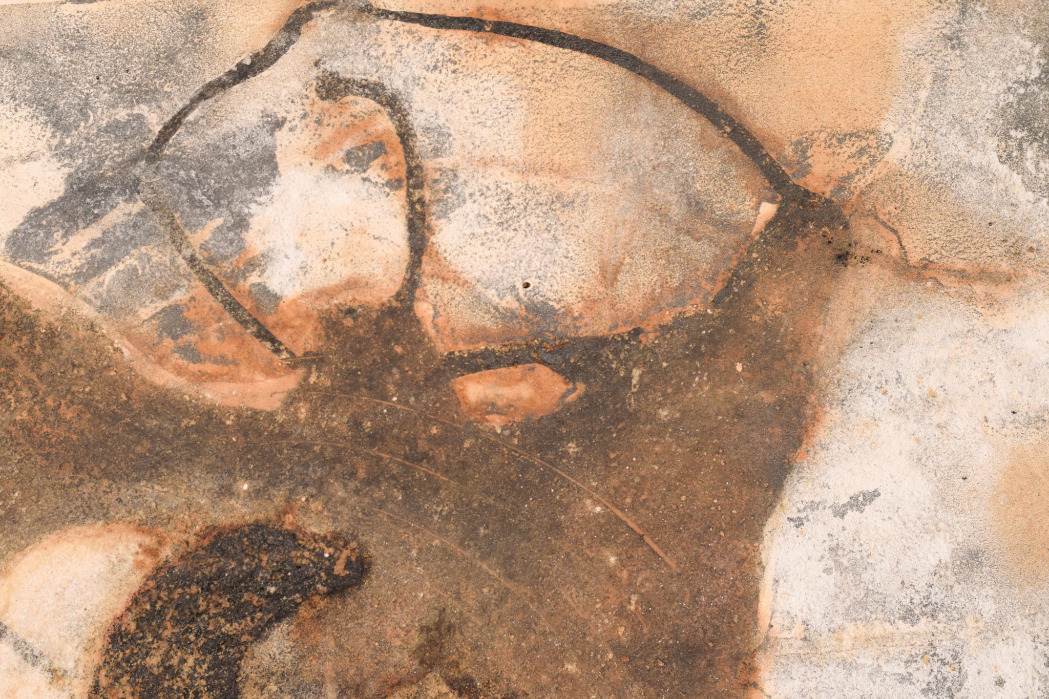 A close up of a piece of art on a wall.