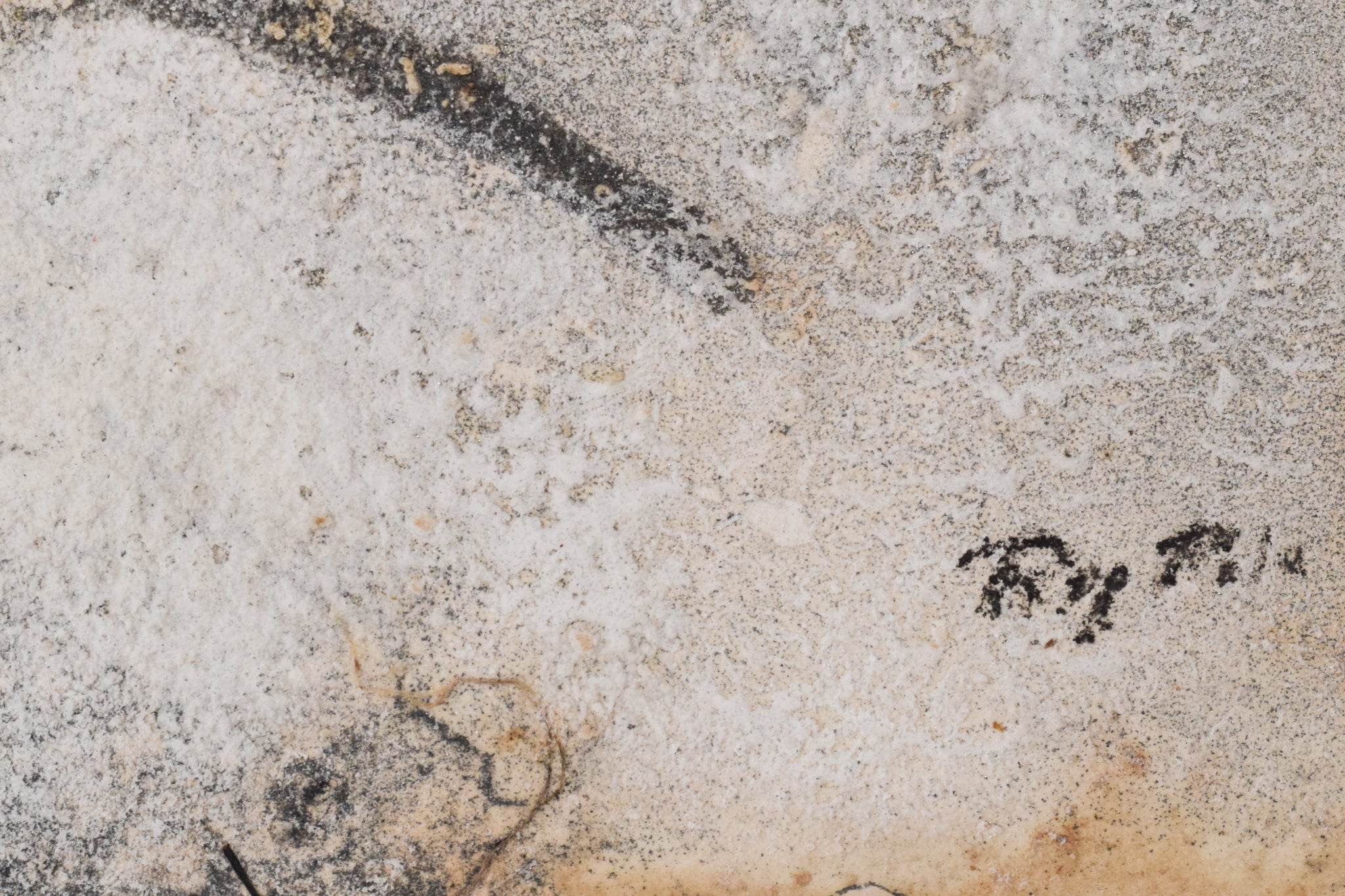 A close up of a piece of art on a wall.