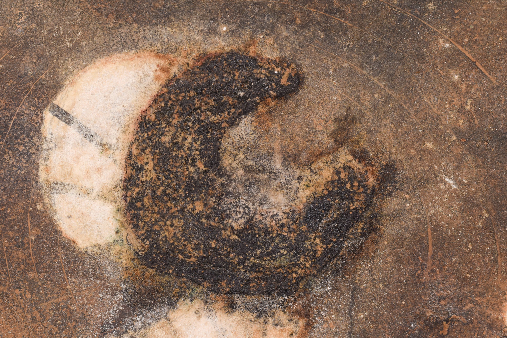 A close up of a piece of art on a wall.