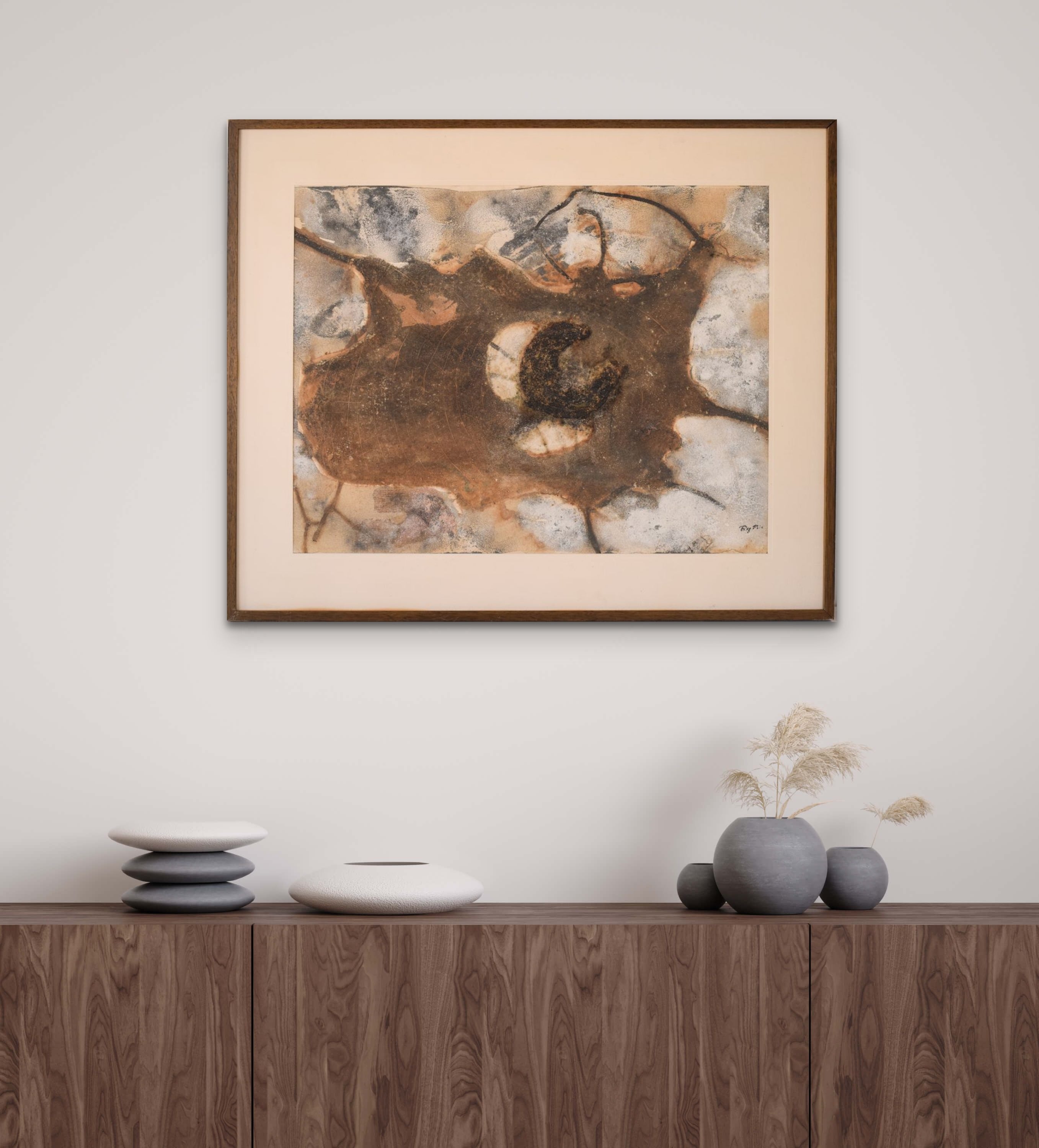 A close up of a piece of art on a wall.