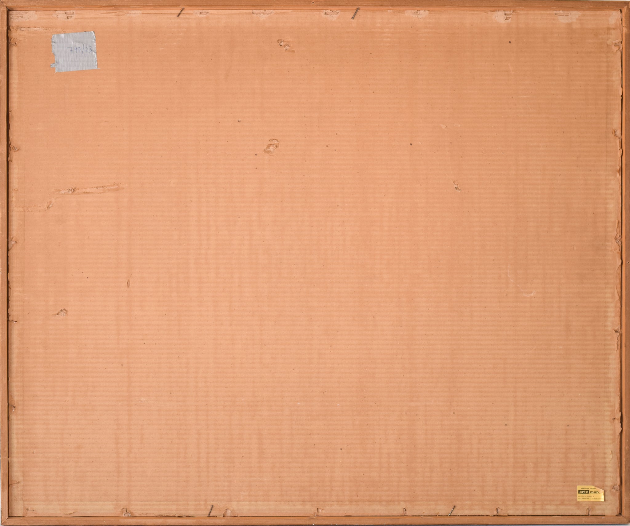 A close up of a piece of art on a wall.