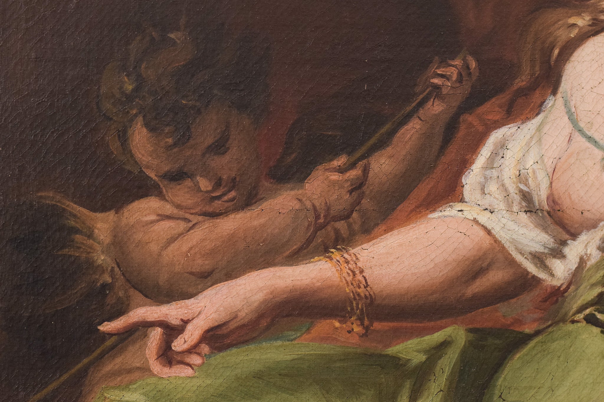 A painting of a woman sitting on a rock with a child.