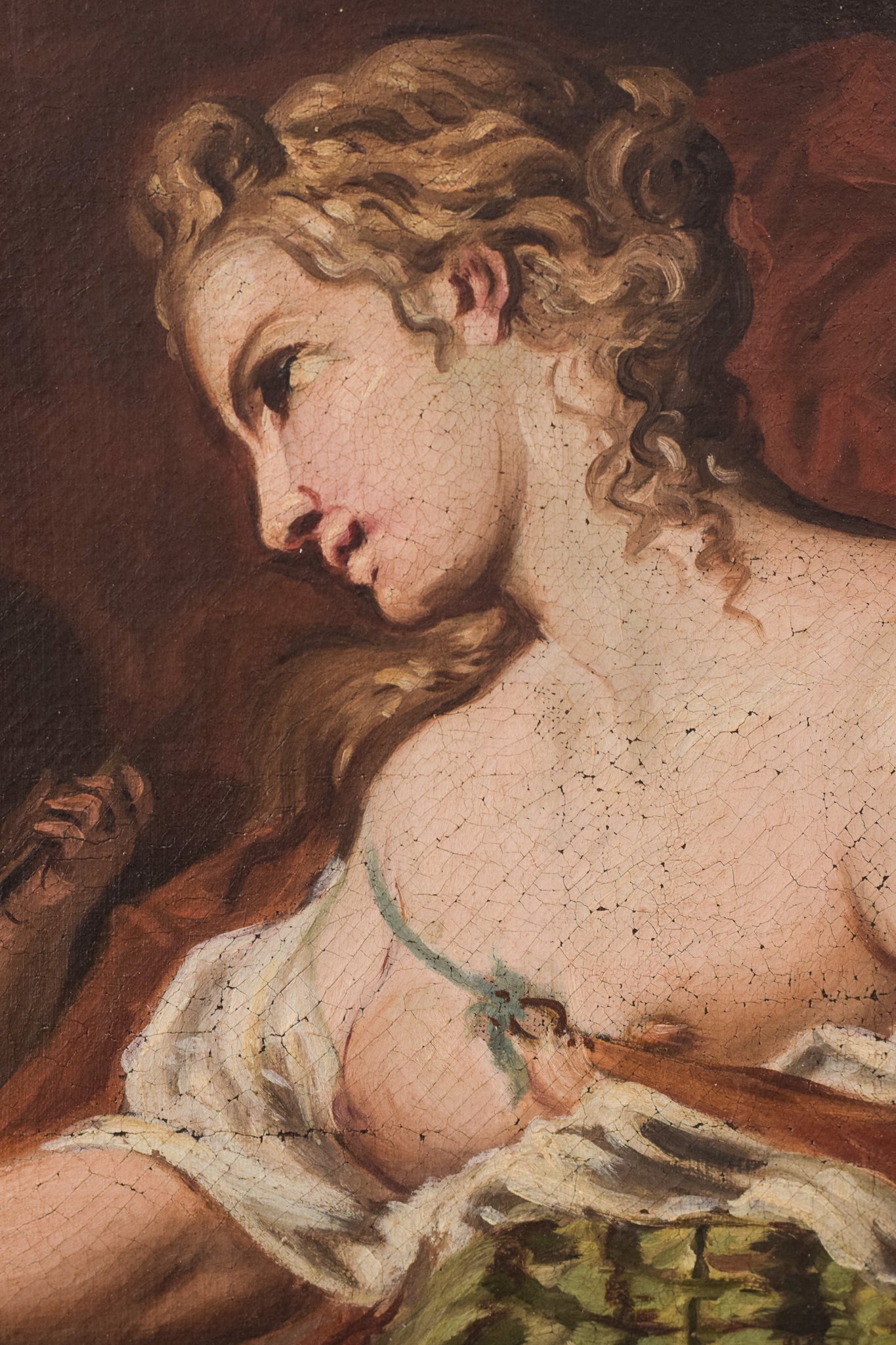 A painting of a woman sitting on a rock with a child.