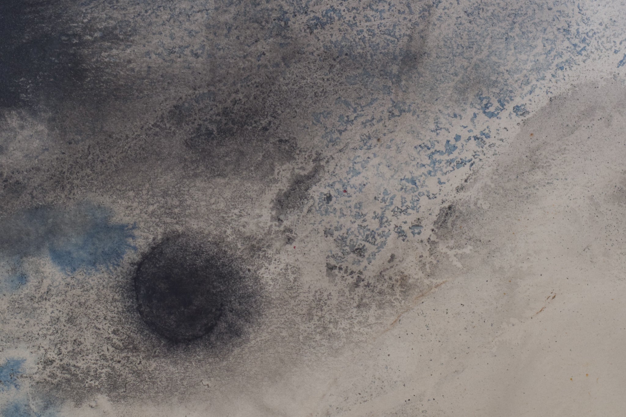 A black and white drawing of a cloudy sky over a field.