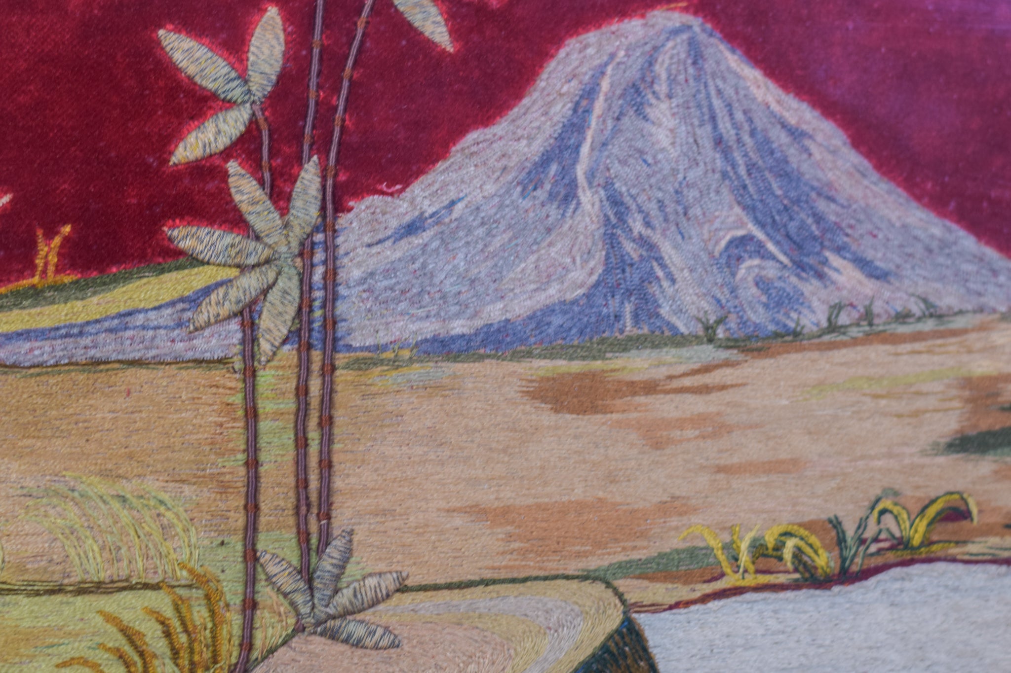 A painting of a landscape with a mountain in the background.